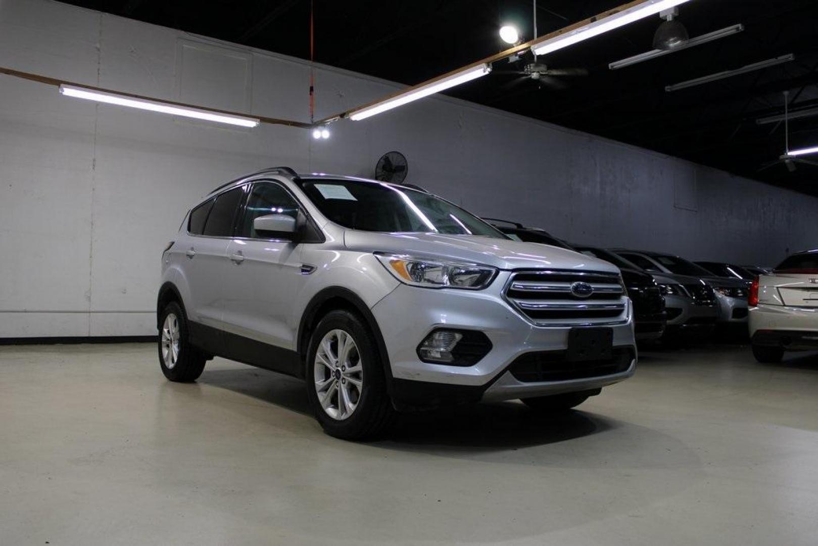 2018 Ingot Silver /Medium Light Stone Ford Escape SE (1FMCU0GD6JU) with an EcoBoost 2.0L I4 GTDi DOHC Turbocharged VCT engine, Automatic transmission, located at 15300 Midway Rd., Addison, TX, 75001, (972) 702-0011, 32.958321, -96.838074 - Photo#1
