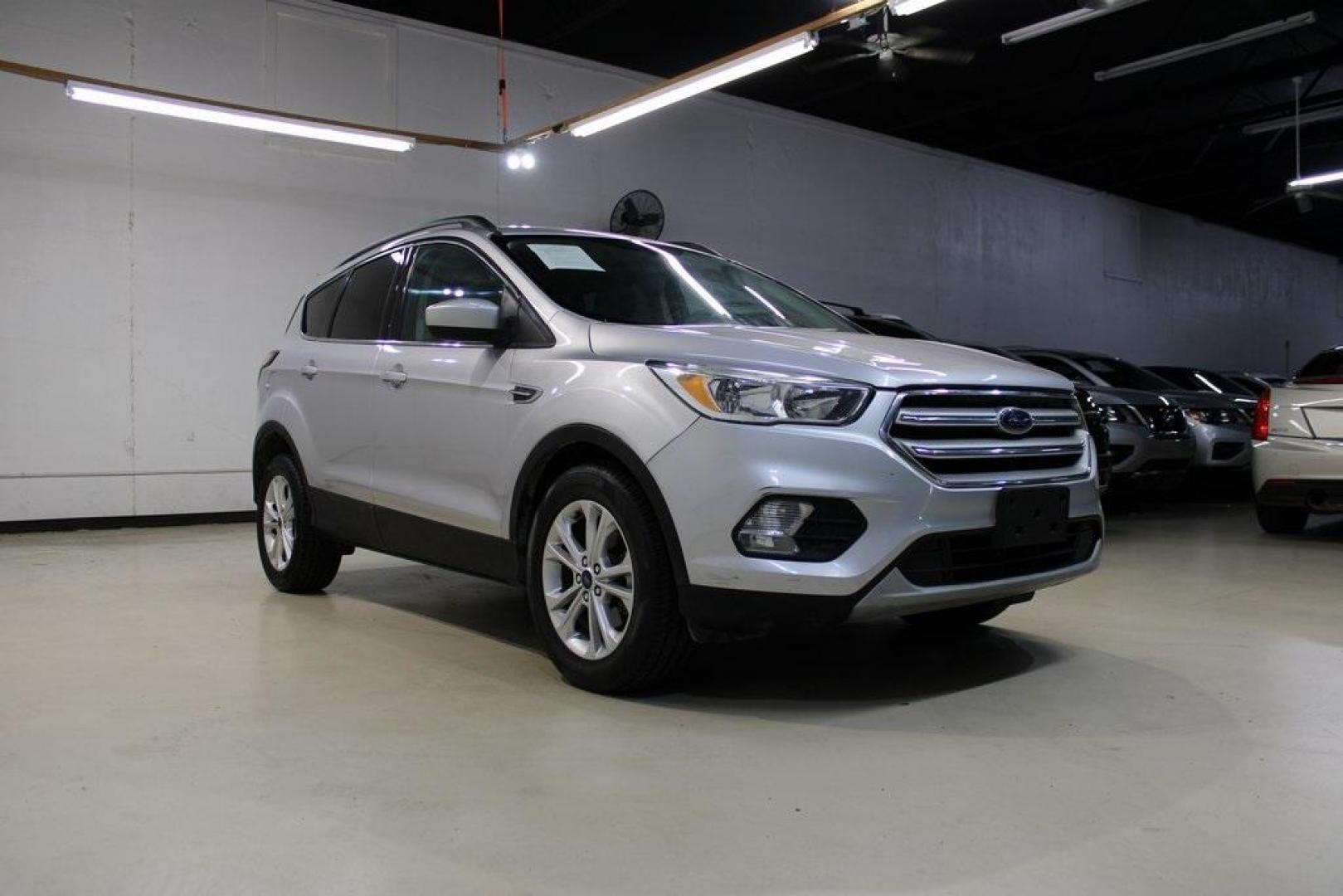 2018 Ingot Silver /Medium Light Stone Ford Escape SE (1FMCU0GD6JU) with an EcoBoost 2.0L I4 GTDi DOHC Turbocharged VCT engine, Automatic transmission, located at 15300 Midway Rd., Addison, TX, 75001, (972) 702-0011, 32.958321, -96.838074 - Photo#2