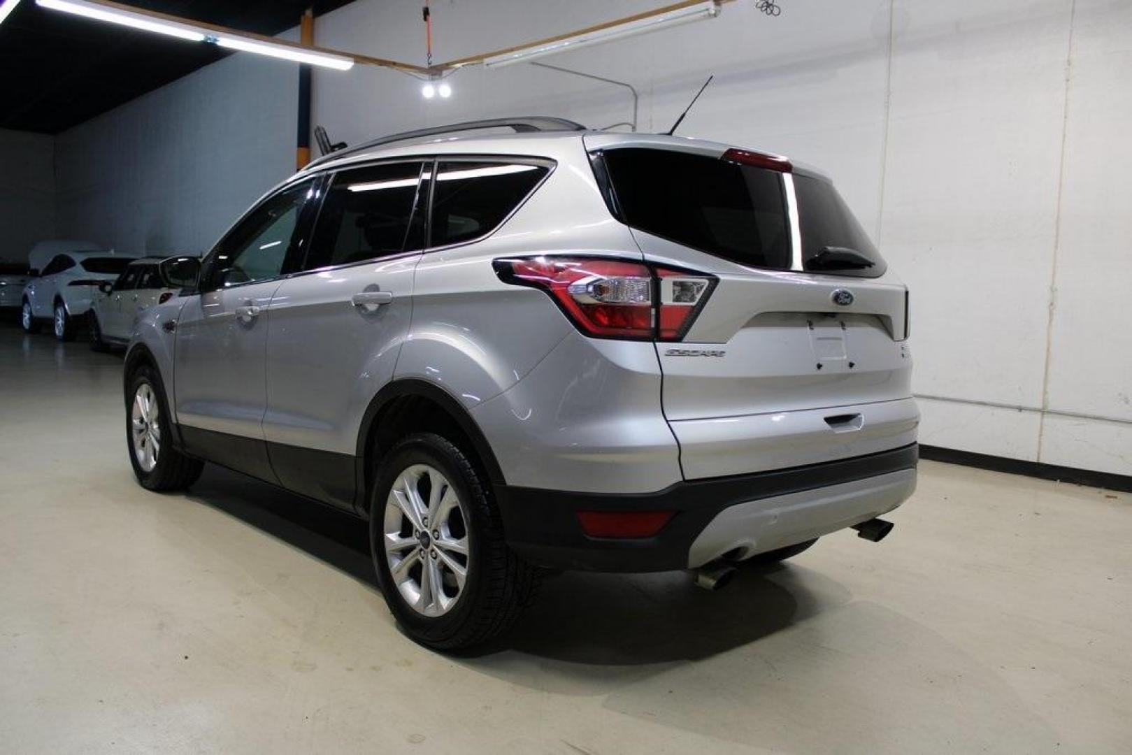 2018 Ingot Silver /Medium Light Stone Ford Escape SE (1FMCU0GD6JU) with an EcoBoost 2.0L I4 GTDi DOHC Turbocharged VCT engine, Automatic transmission, located at 15300 Midway Rd., Addison, TX, 75001, (972) 702-0011, 32.958321, -96.838074 - Photo#4