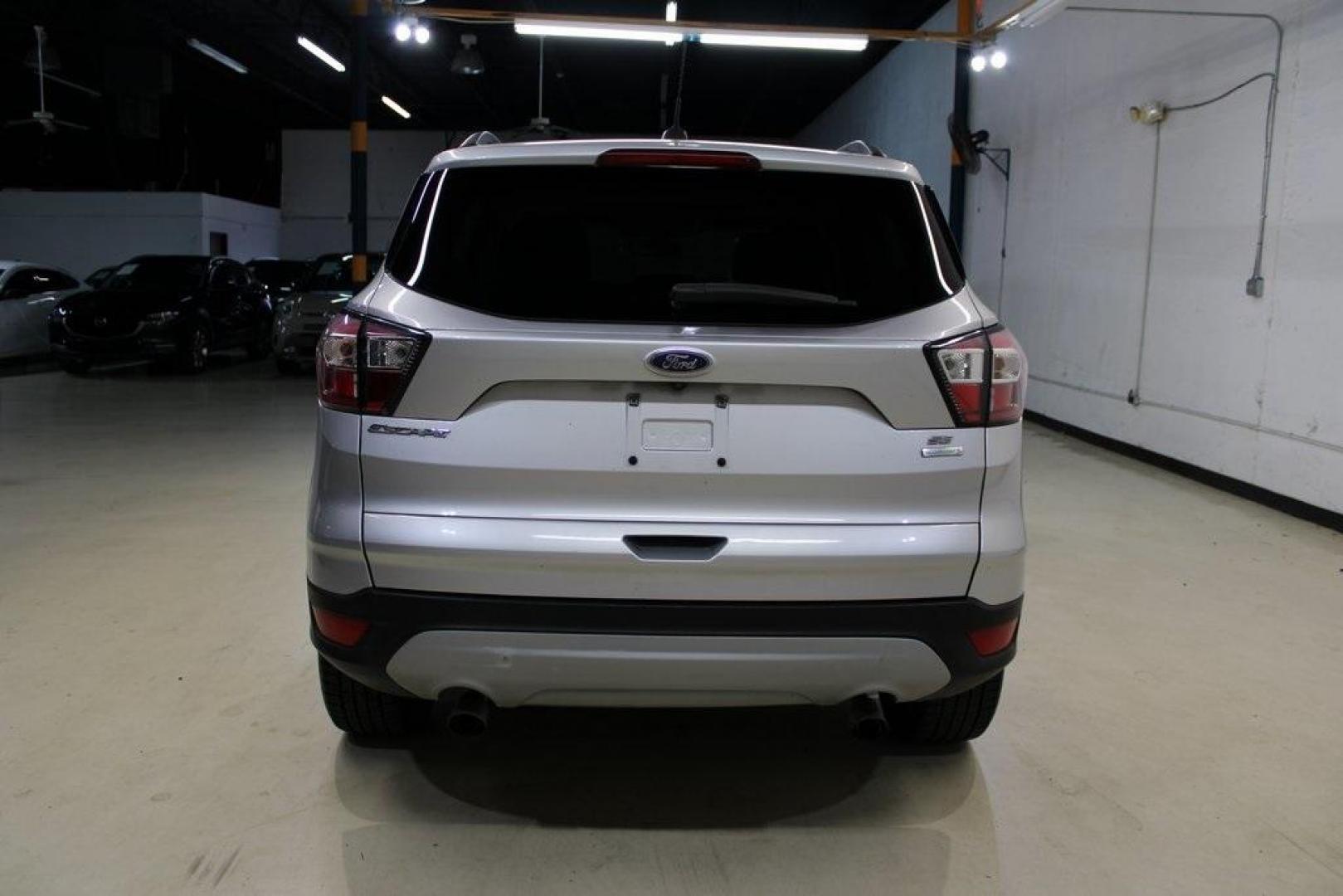 2018 Ingot Silver /Medium Light Stone Ford Escape SE (1FMCU0GD6JU) with an EcoBoost 2.0L I4 GTDi DOHC Turbocharged VCT engine, Automatic transmission, located at 15300 Midway Rd., Addison, TX, 75001, (972) 702-0011, 32.958321, -96.838074 - Photo#9