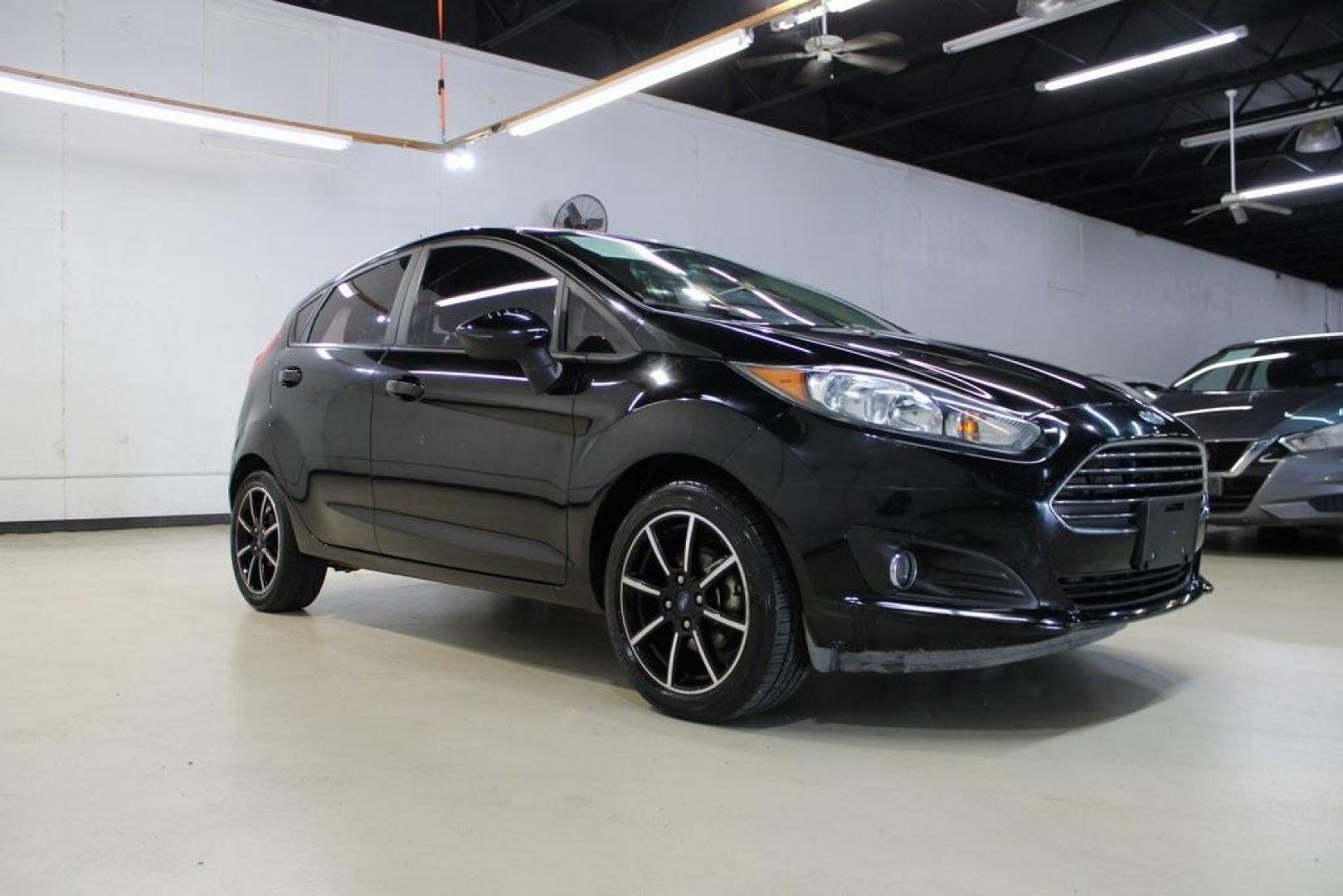 2018 Shadow Black /Charcoal Black Ford Fiesta SE (3FADP4EJ0JM) with an 1.6L I4 Ti-VCT engine, Automatic transmission, located at 15300 Midway Rd., Addison, TX, 75001, (972) 702-0011, 32.958321, -96.838074 - Photo#1