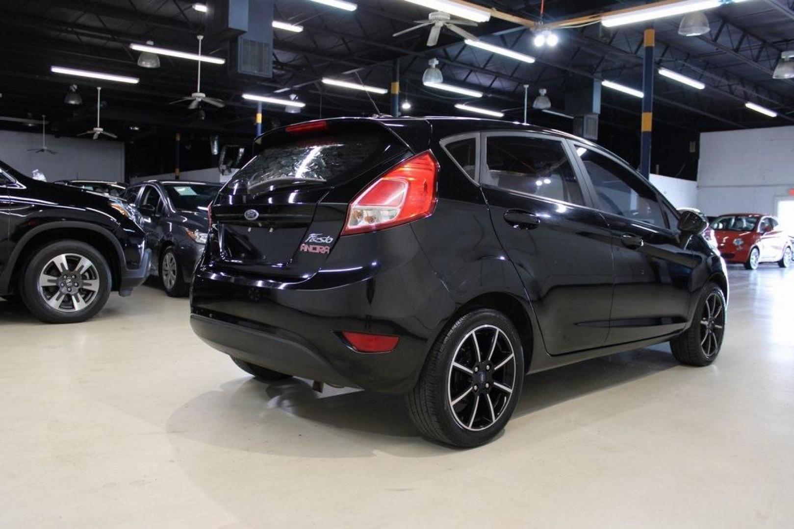 2018 Shadow Black /Charcoal Black Ford Fiesta SE (3FADP4EJ0JM) with an 1.6L I4 Ti-VCT engine, Automatic transmission, located at 15300 Midway Rd., Addison, TX, 75001, (972) 702-0011, 32.958321, -96.838074 - Photo#2