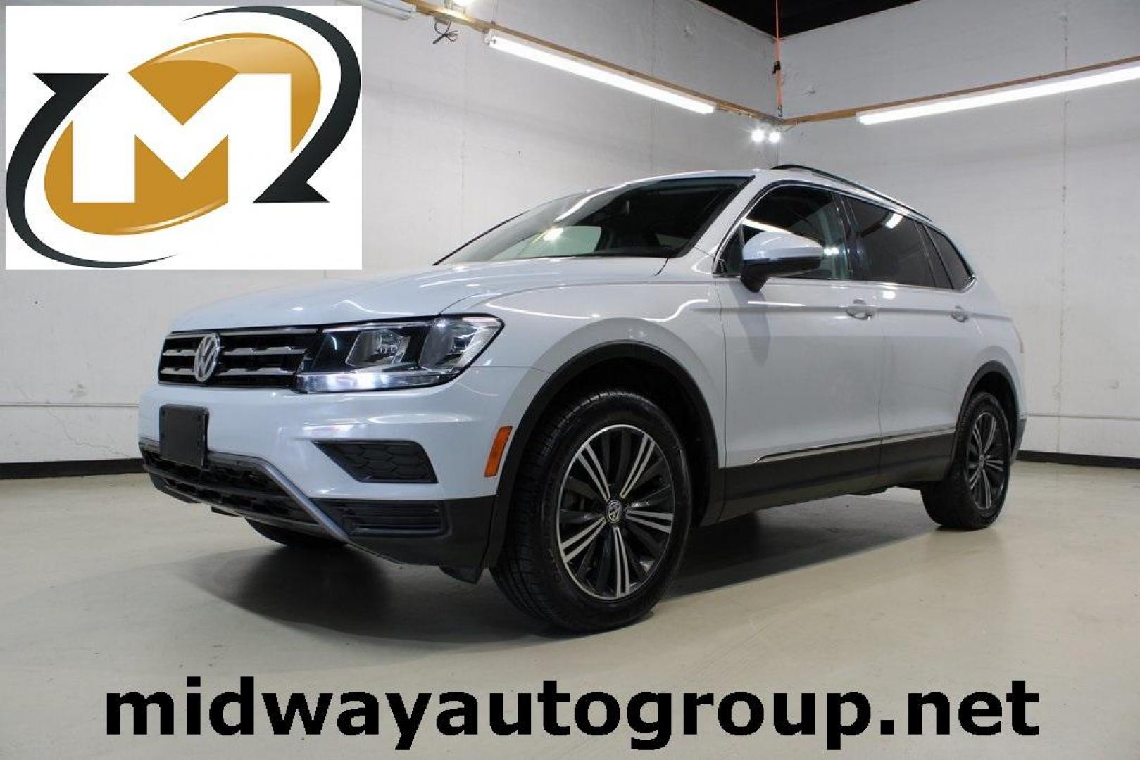 2018 Silk Blue Metallic /Titan Black Volkswagen Tiguan 2.0T SEL (3VV3B7AX2JM) with an 2.0L TSI DOHC engine, Automatic transmission, located at 15300 Midway Rd., Addison, TX, 75001, (972) 702-0011, 32.958321, -96.838074 - Photo#0