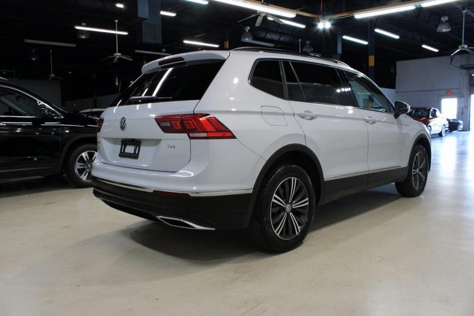2018 Silk Blue Metallic /Titan Black Volkswagen Tiguan 2.0T SEL (3VV3B7AX2JM) with an 2.0L TSI DOHC engine, Automatic transmission, located at 15300 Midway Rd., Addison, TX, 75001, (972) 702-0011, 32.958321, -96.838074 - Photo#2