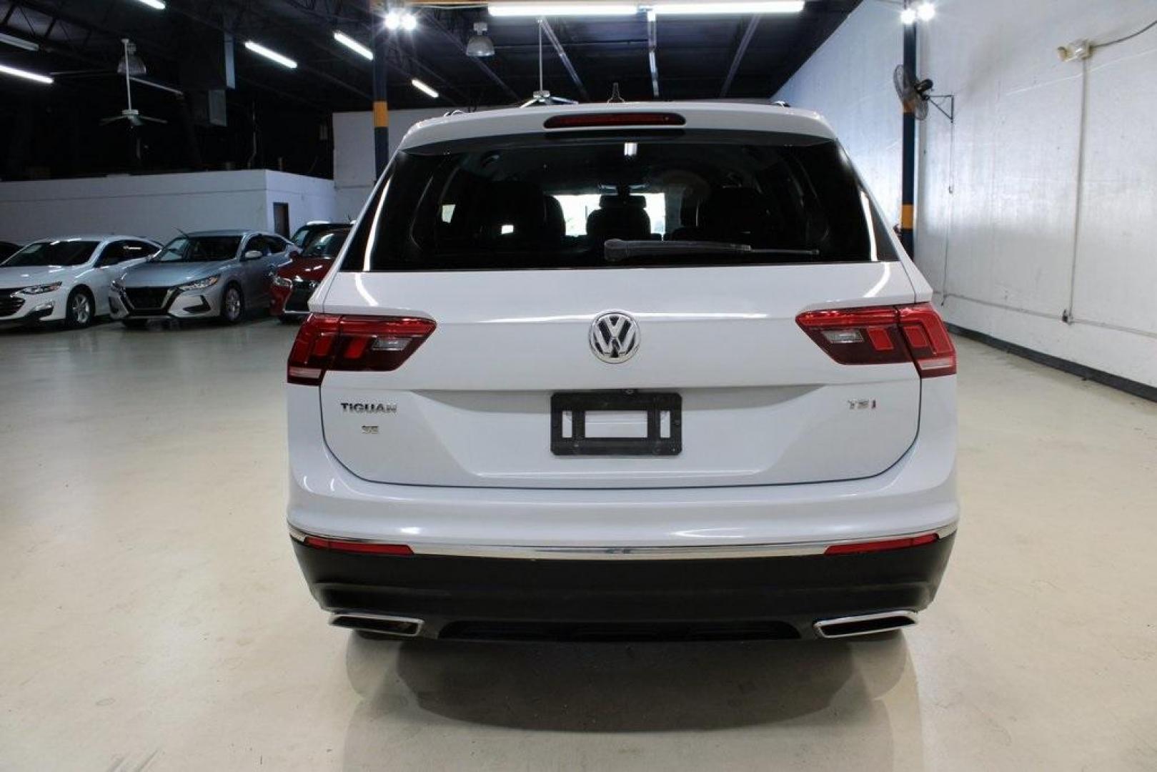 2018 Silk Blue Metallic /Titan Black Volkswagen Tiguan 2.0T SEL (3VV3B7AX2JM) with an 2.0L TSI DOHC engine, Automatic transmission, located at 15300 Midway Rd., Addison, TX, 75001, (972) 702-0011, 32.958321, -96.838074 - Photo#7