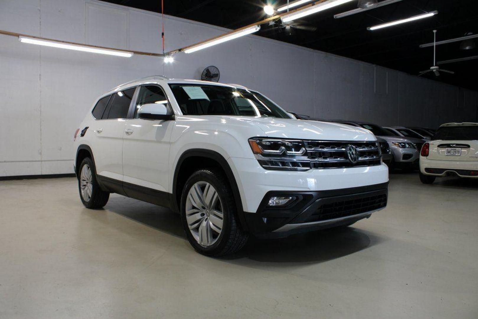 2019 Pure White /Titan Black Volkswagen Atlas 3.6L V6 SE (1V2WR2CA6KC) with an 3.6L VR6 engine, Automatic transmission, located at 15300 Midway Rd., Addison, TX, 75001, (972) 702-0011, 32.958321, -96.838074 - 2019 Volkswagen Atlas SE 4MOTION<br><br>Now Available at Midway Auto Group Addison, Texas<br><br>Spacious, powerful, and family-ready, the 2019 Volkswagen Atlas SE 4MOTION delivers three-row versatility with the confidence of Volkswagens all-wheel-drive system. With its roomy cabin, refined ride qu - Photo#1