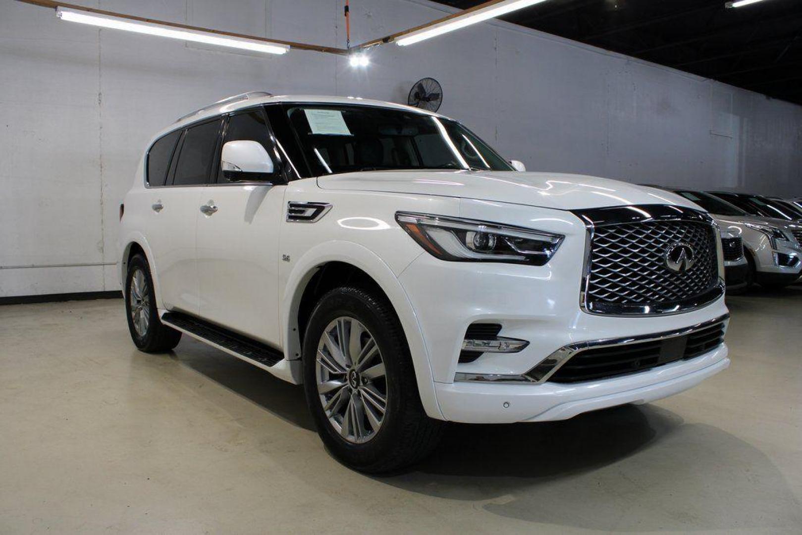 2018 Moonstone White /Graphite INFINITI QX80 Base (JN8AZ2NF0J9) with an 5.6L V8 engine, Automatic transmission, located at 15300 Midway Rd., Addison, TX, 75001, (972) 702-0011, 32.958321, -96.838074 - 2018 INFINITI QX80<br><br>Now Available at Midway Auto Group, Addison, Texas<br><br>Bold, luxurious, and built for families who want full-size capability with premium comfort, the 2018 INFINITI QX80 stands at the top of the luxury SUV segment. With powerful V8 performance, a commanding road presence - Photo#1
