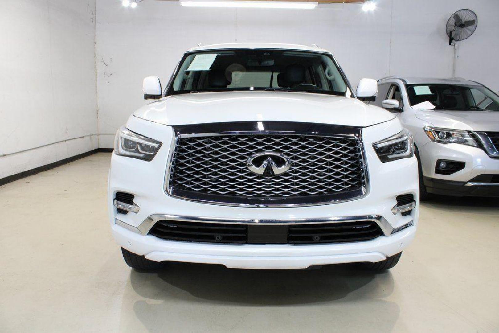 2018 Moonstone White /Graphite INFINITI QX80 Base (JN8AZ2NF0J9) with an 5.6L V8 engine, Automatic transmission, located at 15300 Midway Rd., Addison, TX, 75001, (972) 702-0011, 32.958321, -96.838074 - 2018 INFINITI QX80<br><br>Now Available at Midway Auto Group, Addison, Texas<br><br>Bold, luxurious, and built for families who want full-size capability with premium comfort, the 2018 INFINITI QX80 stands at the top of the luxury SUV segment. With powerful V8 performance, a commanding road presence - Photo#5