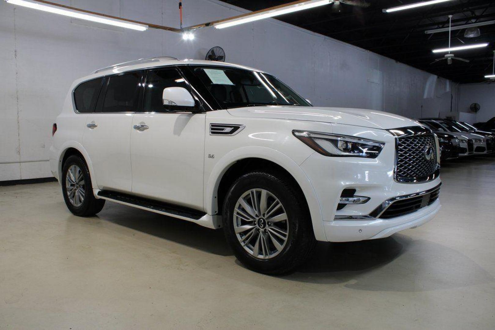 2018 Moonstone White /Graphite INFINITI QX80 Base (JN8AZ2NF0J9) with an 5.6L V8 engine, Automatic transmission, located at 15300 Midway Rd., Addison, TX, 75001, (972) 702-0011, 32.958321, -96.838074 - 2018 INFINITI QX80<br><br>Now Available at Midway Auto Group, Addison, Texas<br><br>Bold, luxurious, and built for families who want full-size capability with premium comfort, the 2018 INFINITI QX80 stands at the top of the luxury SUV segment. With powerful V8 performance, a commanding road presence - Photo#6