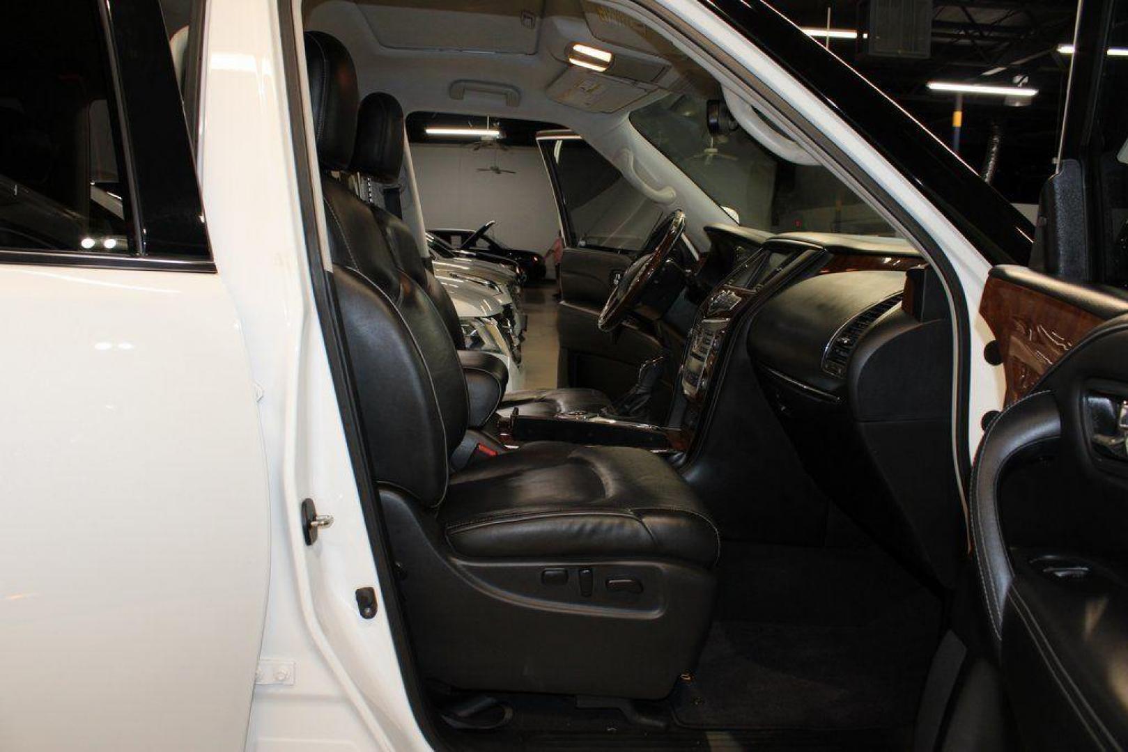 2018 Moonstone White /Graphite INFINITI QX80 Base (JN8AZ2NF0J9) with an 5.6L V8 engine, Automatic transmission, located at 15300 Midway Rd., Addison, TX, 75001, (972) 702-0011, 32.958321, -96.838074 - 2018 INFINITI QX80<br><br>Now Available at Midway Auto Group, Addison, Texas<br><br>Bold, luxurious, and built for families who want full-size capability with premium comfort, the 2018 INFINITI QX80 stands at the top of the luxury SUV segment. With powerful V8 performance, a commanding road presence - Photo#14