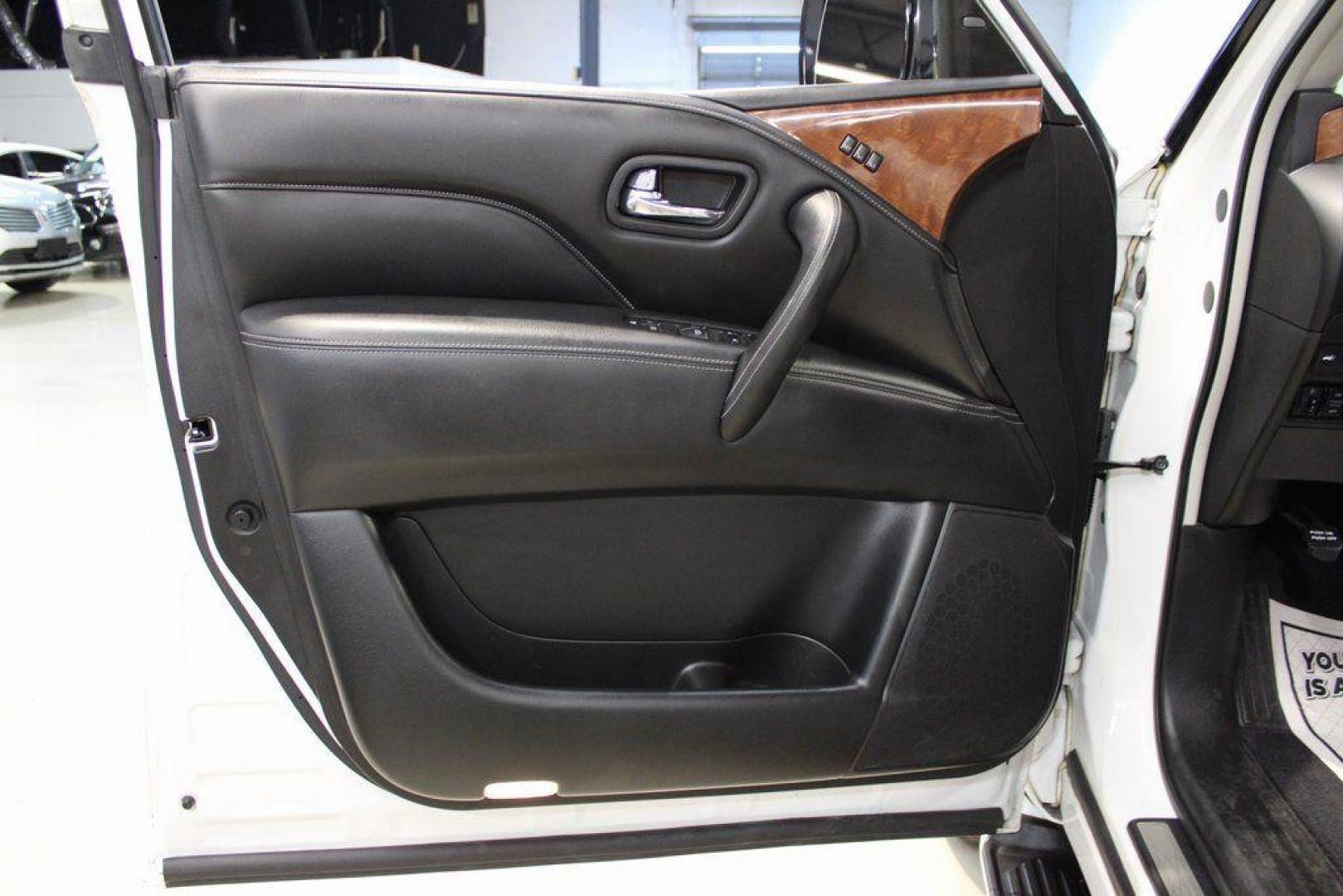 2018 Moonstone White /Graphite INFINITI QX80 Base (JN8AZ2NF0J9) with an 5.6L V8 engine, Automatic transmission, located at 15300 Midway Rd., Addison, TX, 75001, (972) 702-0011, 32.958321, -96.838074 - 2018 INFINITI QX80<br><br>Now Available at Midway Auto Group, Addison, Texas<br><br>Bold, luxurious, and built for families who want full-size capability with premium comfort, the 2018 INFINITI QX80 stands at the top of the luxury SUV segment. With powerful V8 performance, a commanding road presence - Photo#29