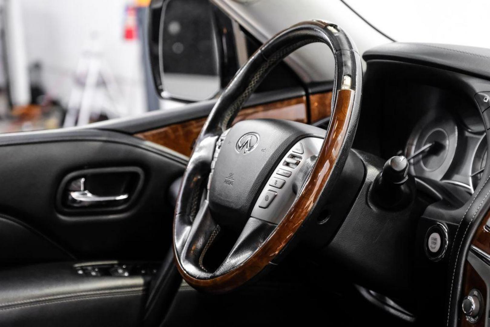 2018 Moonstone /Graphite INFINITI QX80 Base (JN8AZ2NF0J9) with an 5.6L V8 engine, Automatic transmission, located at 15300 Midway Rd., Addison, TX, 75001, (972) 702-0011, 32.958321, -96.838074 - 2018 INFINITI QX80<br><br>Now Available at Midway Auto Group, Addison, Texas<br><br>Bold, luxurious, and built for families who want full-size capability with premium comfort, the 2018 INFINITI QX80 stands at the top of the luxury SUV segment. With powerful V8 performance, a commanding road presence - Photo#13