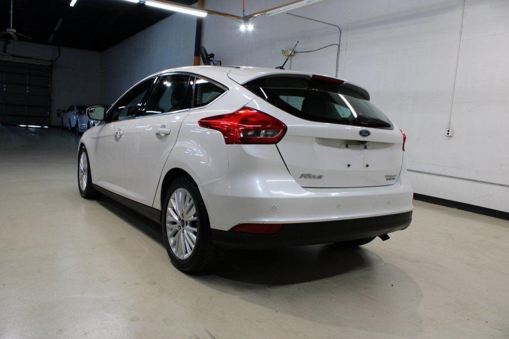 2016 White Platinum Clearcoat Metallic /Medium Soft Ceramic Ford Focus Titanium (1FADP3N2XGL) with an 2.0L I4 DGI Flex Fuel Ti-VCT engine, Automatic transmission, located at 15300 Midway Rd., Addison, TX, 75001, (972) 702-0011, 32.958321, -96.838074 - 2016 Ford Focus SE<br><br>Now Available at Midway Auto Group Addison, Texas<br><br>Efficient, comfortable, and versatilethe 2016 Ford Focus SE offers a great blend of fuel economy, modern technology, and everyday practicality. Whether you're commuting across DFW or looking for a reliable compact ca - Photo#2