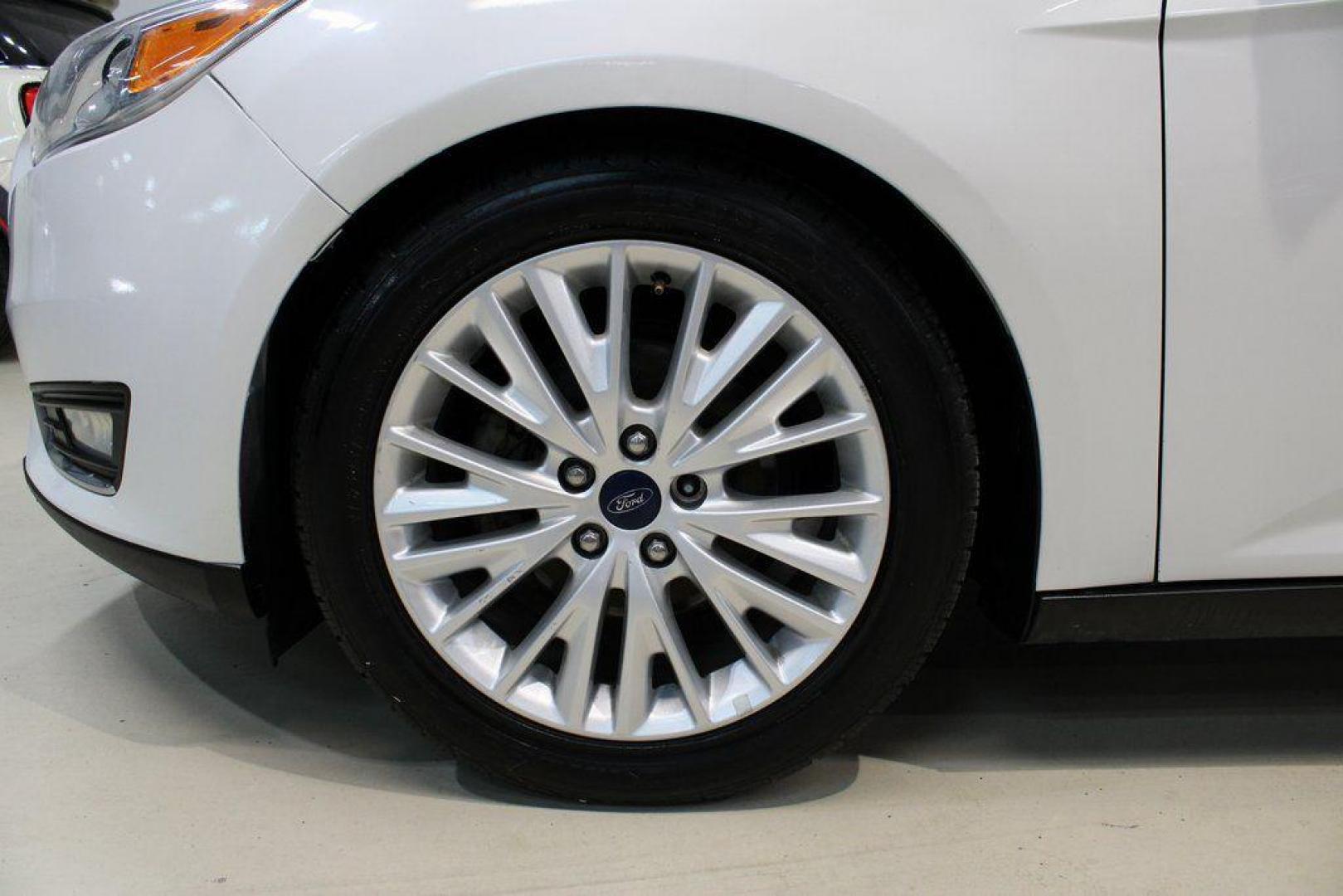 2016 White Platinum Clearcoat Metallic /Medium Soft Ceramic Ford Focus Titanium (1FADP3N2XGL) with an 2.0L I4 DGI Flex Fuel Ti-VCT engine, Automatic transmission, located at 15300 Midway Rd., Addison, TX, 75001, (972) 702-0011, 32.958321, -96.838074 - 2016 Ford Focus SE<br><br>Now Available at Midway Auto Group Addison, Texas<br><br>Efficient, comfortable, and versatilethe 2016 Ford Focus SE offers a great blend of fuel economy, modern technology, and everyday practicality. Whether you're commuting across DFW or looking for a reliable compact ca - Photo#5