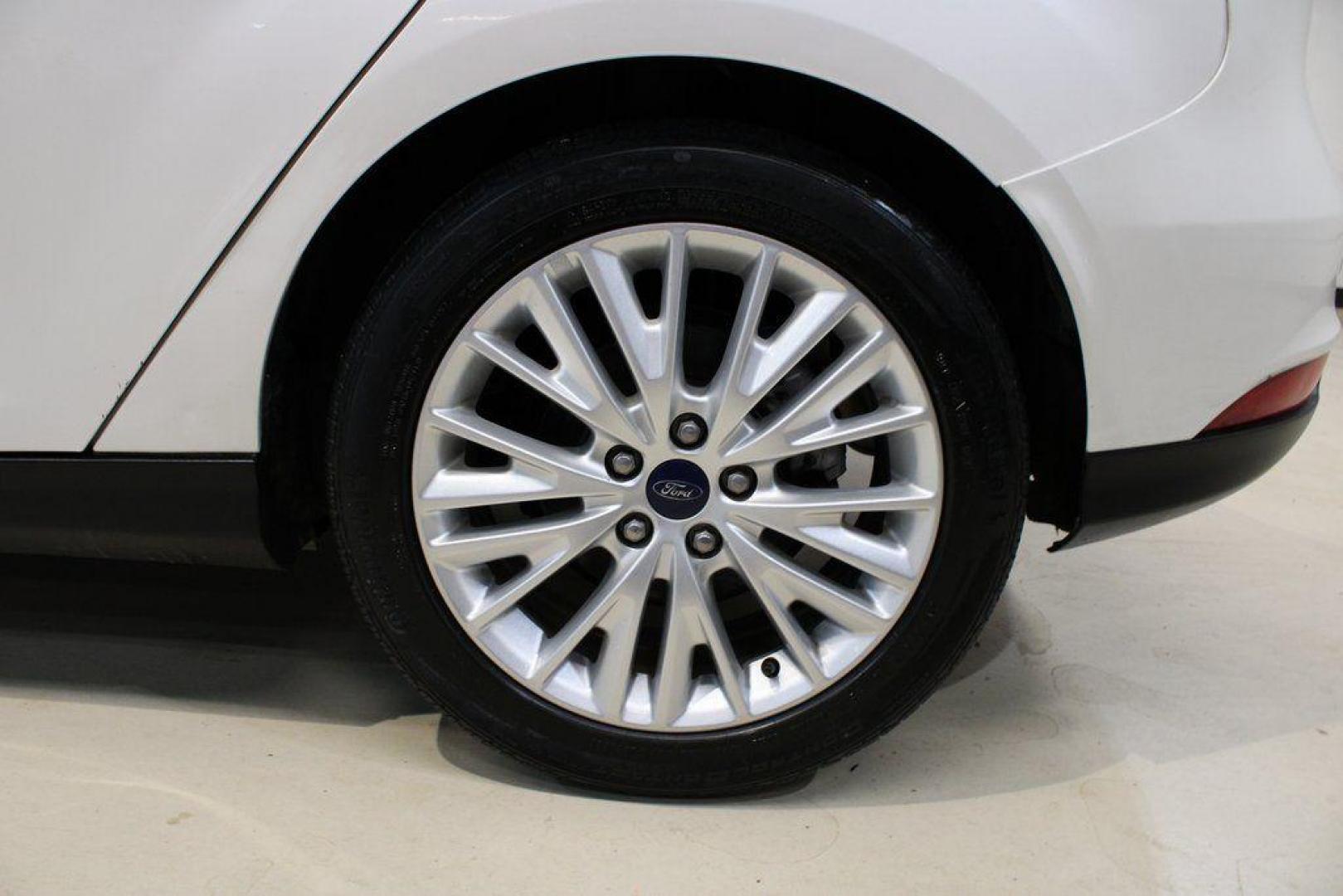 2016 White Platinum Clearcoat Metallic /Medium Soft Ceramic Ford Focus Titanium (1FADP3N2XGL) with an 2.0L I4 DGI Flex Fuel Ti-VCT engine, Automatic transmission, located at 15300 Midway Rd., Addison, TX, 75001, (972) 702-0011, 32.958321, -96.838074 - 2016 Ford Focus SE<br><br>Now Available at Midway Auto Group Addison, Texas<br><br>Efficient, comfortable, and versatilethe 2016 Ford Focus SE offers a great blend of fuel economy, modern technology, and everyday practicality. Whether you're commuting across DFW or looking for a reliable compact ca - Photo#6