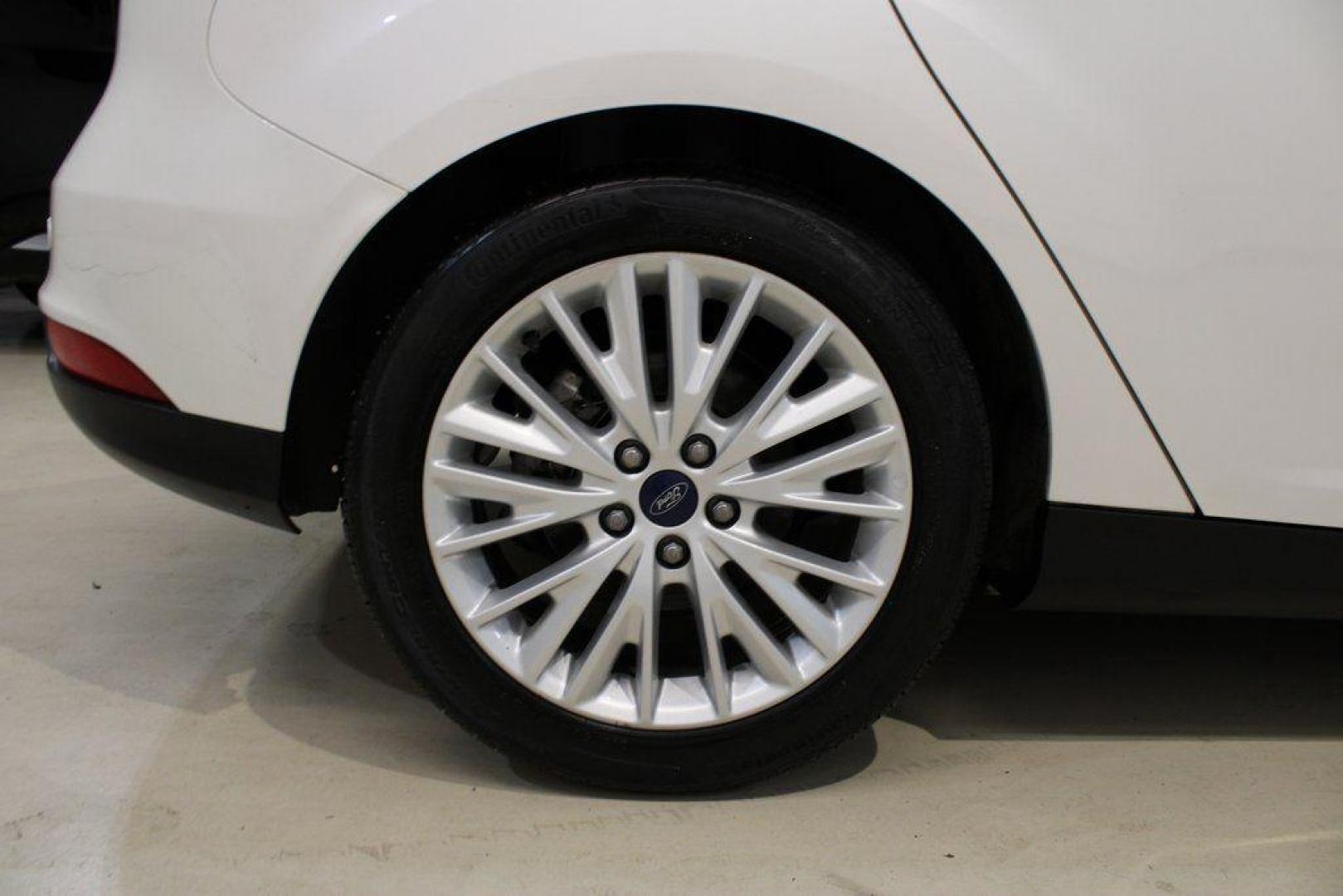 2016 White Platinum Clearcoat Metallic /Medium Soft Ceramic Ford Focus Titanium (1FADP3N2XGL) with an 2.0L I4 DGI Flex Fuel Ti-VCT engine, Automatic transmission, located at 15300 Midway Rd., Addison, TX, 75001, (972) 702-0011, 32.958321, -96.838074 - 2016 Ford Focus SE<br><br>Now Available at Midway Auto Group Addison, Texas<br><br>Efficient, comfortable, and versatilethe 2016 Ford Focus SE offers a great blend of fuel economy, modern technology, and everyday practicality. Whether you're commuting across DFW or looking for a reliable compact ca - Photo#7