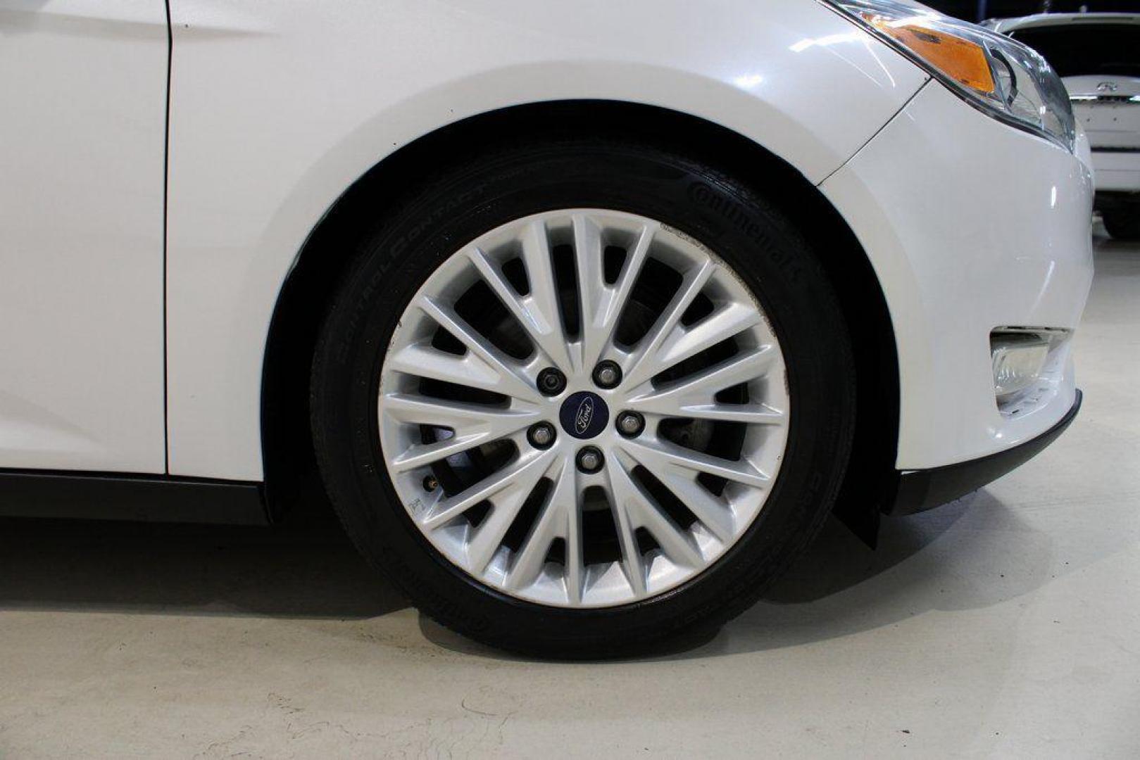 2016 White Platinum Clearcoat Metallic /Medium Soft Ceramic Ford Focus Titanium (1FADP3N2XGL) with an 2.0L I4 DGI Flex Fuel Ti-VCT engine, Automatic transmission, located at 15300 Midway Rd., Addison, TX, 75001, (972) 702-0011, 32.958321, -96.838074 - 2016 Ford Focus SE<br><br>Now Available at Midway Auto Group Addison, Texas<br><br>Efficient, comfortable, and versatilethe 2016 Ford Focus SE offers a great blend of fuel economy, modern technology, and everyday practicality. Whether you're commuting across DFW or looking for a reliable compact ca - Photo#8