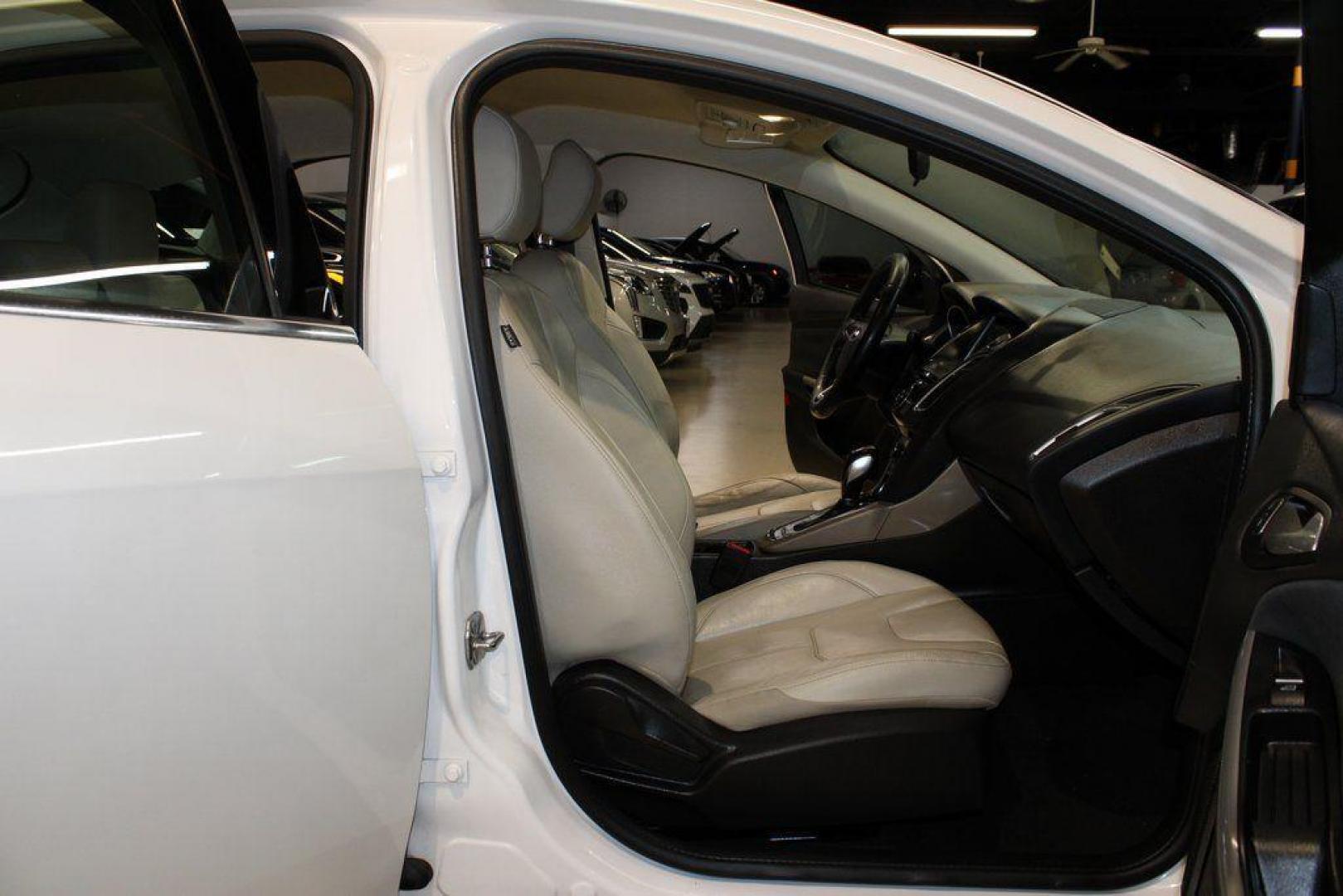 2016 White Platinum Clearcoat Metallic /Medium Soft Ceramic Ford Focus Titanium (1FADP3N2XGL) with an 2.0L I4 DGI Flex Fuel Ti-VCT engine, Automatic transmission, located at 15300 Midway Rd., Addison, TX, 75001, (972) 702-0011, 32.958321, -96.838074 - 2016 Ford Focus SE<br><br>Now Available at Midway Auto Group Addison, Texas<br><br>Efficient, comfortable, and versatilethe 2016 Ford Focus SE offers a great blend of fuel economy, modern technology, and everyday practicality. Whether you're commuting across DFW or looking for a reliable compact ca - Photo#10