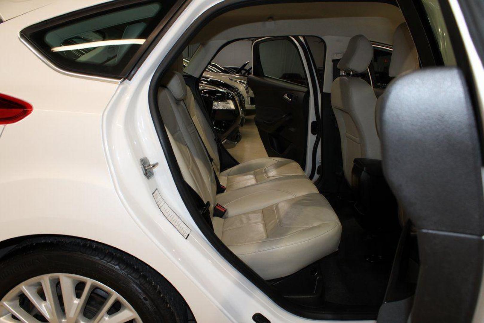 2016 White Platinum Clearcoat Metallic /Medium Soft Ceramic Ford Focus Titanium (1FADP3N2XGL) with an 2.0L I4 DGI Flex Fuel Ti-VCT engine, Automatic transmission, located at 15300 Midway Rd., Addison, TX, 75001, (972) 702-0011, 32.958321, -96.838074 - 2016 Ford Focus SE<br><br>Now Available at Midway Auto Group Addison, Texas<br><br>Efficient, comfortable, and versatilethe 2016 Ford Focus SE offers a great blend of fuel economy, modern technology, and everyday practicality. Whether you're commuting across DFW or looking for a reliable compact ca - Photo#11