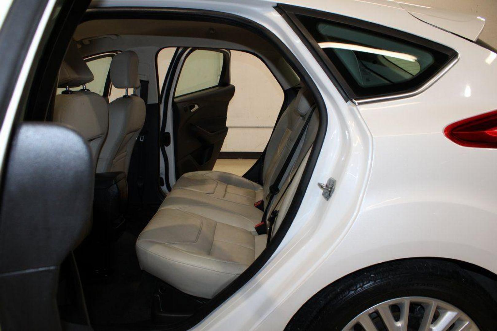 2016 White Platinum Clearcoat Metallic /Medium Soft Ceramic Ford Focus Titanium (1FADP3N2XGL) with an 2.0L I4 DGI Flex Fuel Ti-VCT engine, Automatic transmission, located at 15300 Midway Rd., Addison, TX, 75001, (972) 702-0011, 32.958321, -96.838074 - 2016 Ford Focus SE<br><br>Now Available at Midway Auto Group Addison, Texas<br><br>Efficient, comfortable, and versatilethe 2016 Ford Focus SE offers a great blend of fuel economy, modern technology, and everyday practicality. Whether you're commuting across DFW or looking for a reliable compact ca - Photo#12