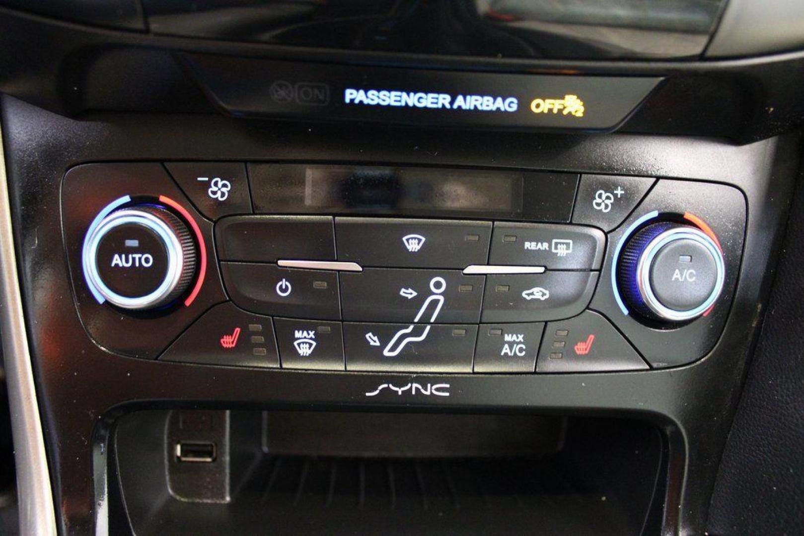 2016 White Platinum Clearcoat Metallic /Medium Soft Ceramic Ford Focus Titanium (1FADP3N2XGL) with an 2.0L I4 DGI Flex Fuel Ti-VCT engine, Automatic transmission, located at 15300 Midway Rd., Addison, TX, 75001, (972) 702-0011, 32.958321, -96.838074 - 2016 Ford Focus SE<br><br>Now Available at Midway Auto Group Addison, Texas<br><br>Efficient, comfortable, and versatilethe 2016 Ford Focus SE offers a great blend of fuel economy, modern technology, and everyday practicality. Whether you're commuting across DFW or looking for a reliable compact ca - Photo#16