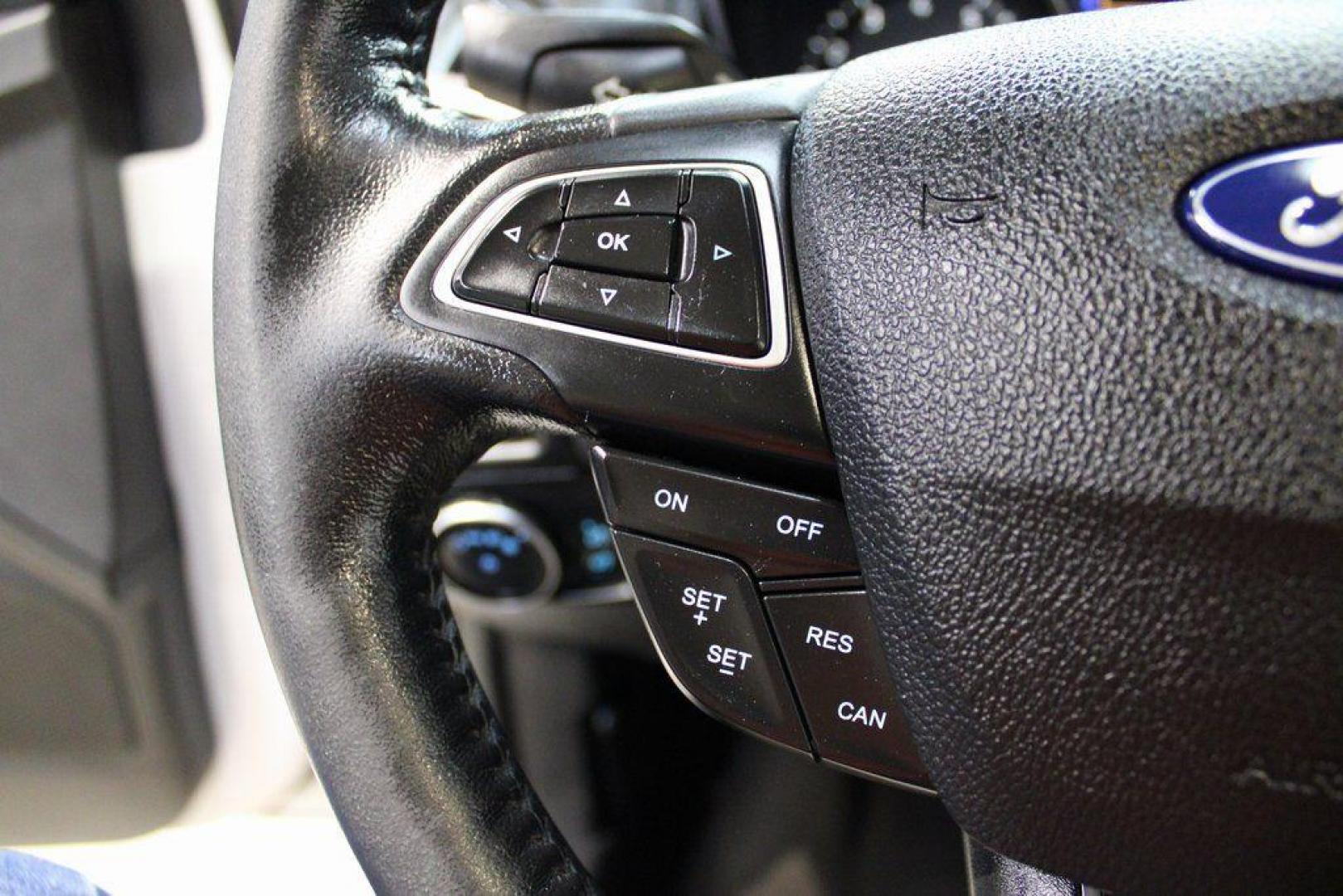 2016 White Platinum Clearcoat Metallic /Medium Soft Ceramic Ford Focus Titanium (1FADP3N2XGL) with an 2.0L I4 DGI Flex Fuel Ti-VCT engine, Automatic transmission, located at 15300 Midway Rd., Addison, TX, 75001, (972) 702-0011, 32.958321, -96.838074 - 2016 Ford Focus SE<br><br>Now Available at Midway Auto Group Addison, Texas<br><br>Efficient, comfortable, and versatilethe 2016 Ford Focus SE offers a great blend of fuel economy, modern technology, and everyday practicality. Whether you're commuting across DFW or looking for a reliable compact ca - Photo#19