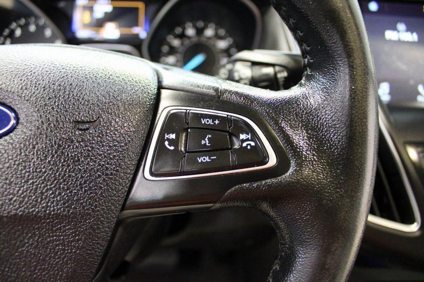 2016 White Platinum Clearcoat Metallic /Medium Soft Ceramic Ford Focus Titanium (1FADP3N2XGL) with an 2.0L I4 DGI Flex Fuel Ti-VCT engine, Automatic transmission, located at 15300 Midway Rd., Addison, TX, 75001, (972) 702-0011, 32.958321, -96.838074 - 2016 Ford Focus SE<br><br>Now Available at Midway Auto Group Addison, Texas<br><br>Efficient, comfortable, and versatilethe 2016 Ford Focus SE offers a great blend of fuel economy, modern technology, and everyday practicality. Whether you're commuting across DFW or looking for a reliable compact ca - Photo#20