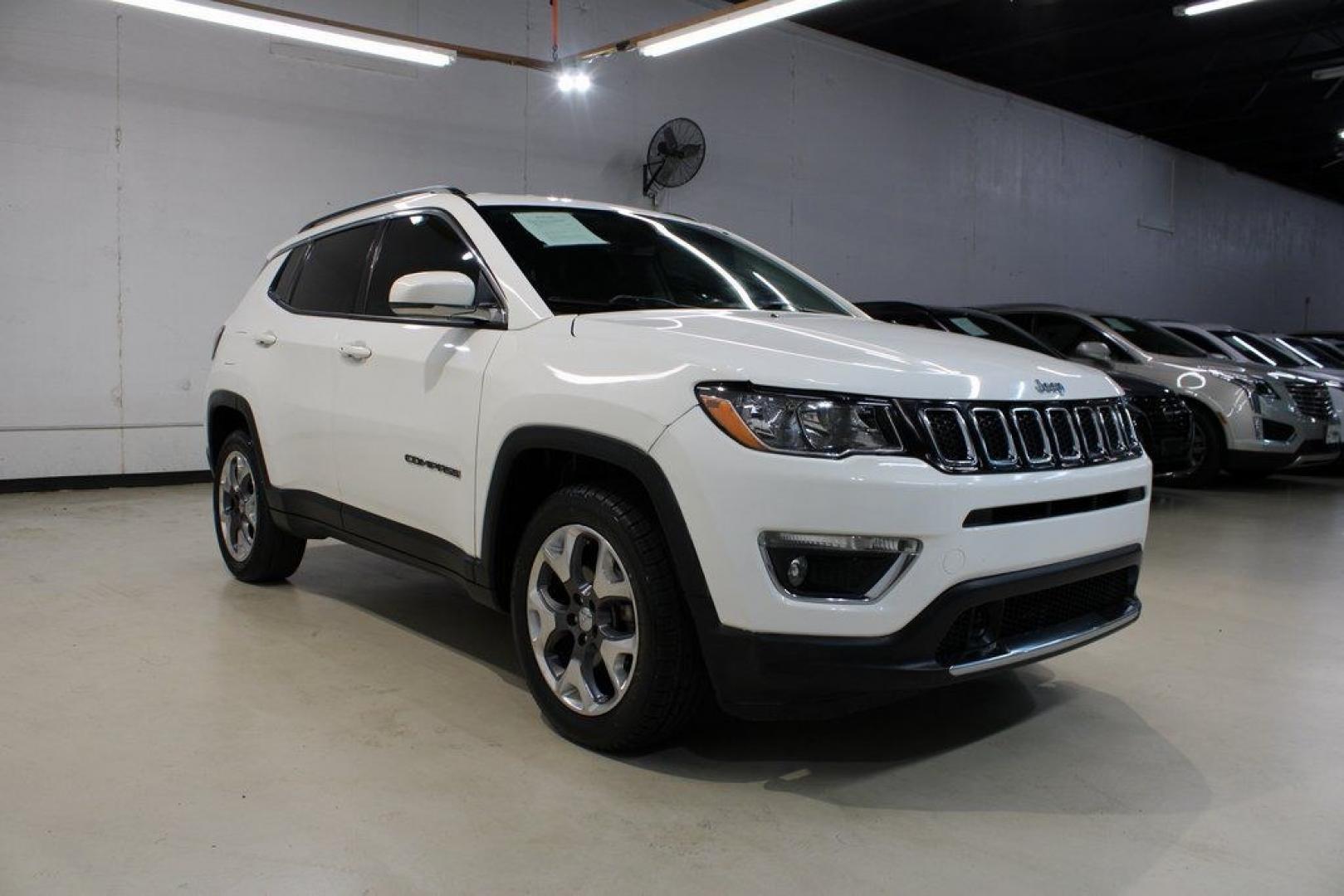 2021 White Clearcoat /Black Jeep Compass Limited (3C4NJDCB3MT) with an 2.4L I4 engine, Automatic transmission, located at 15300 Midway Rd., Addison, TX, 75001, (972) 702-0011, 32.958321, -96.838074 - 2021 Jeep Compass Limited 4x4<br><br>Now Available at Midway Auto Group Addison, Texas<br><br>Premium design, advanced technology, and true Jeep capability come together in the 2021 Jeep Compass Limited 4x4. As the top luxury trim in the Compass lineup, the Limited delivers upgraded materials, refi- Photo#1