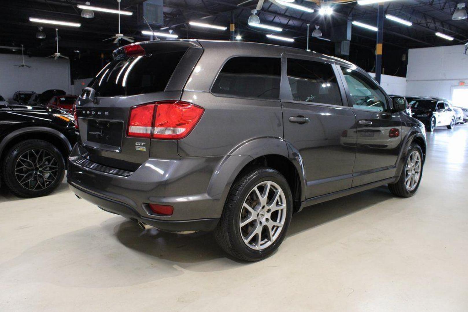 2018 Granite Crystal Metallic Clearcoat /Red Dodge Journey GT (3C4PDCEG0JT) with an 3.6L V6 24V VVT engine, Automatic transmission, located at 15300 Midway Rd., Addison, TX, 75001, (972) 702-0011, 32.958321, -96.838074 - 2018 Dodge Journey GT<br><br>Now Available at Midway Auto Group Addison, Texas<br><br>The 2018 Dodge Journey GT delivers a perfect blend of performance, comfort, and versatility. As the top trim level, the GT stands above the rest with premium interior materials, upgraded technology, and a powerful - Photo#1