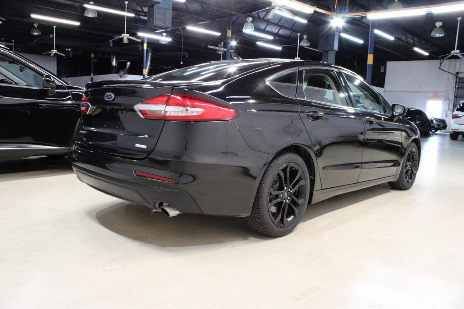 2019 Black /Light Putty Ford Fusion SE (3FA6P0HD1KR) with an 1.5L EcoBoost engine, Automatic transmission, located at 15300 Midway Rd., Addison, TX, 75001, (972) 702-0011, 32.958321, -96.838074 - Photo#2