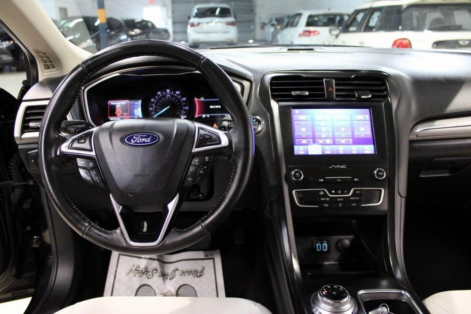2019 Black /Light Putty Ford Fusion SE (3FA6P0HD1KR) with an 1.5L EcoBoost engine, Automatic transmission, located at 15300 Midway Rd., Addison, TX, 75001, (972) 702-0011, 32.958321, -96.838074 - Photo#16