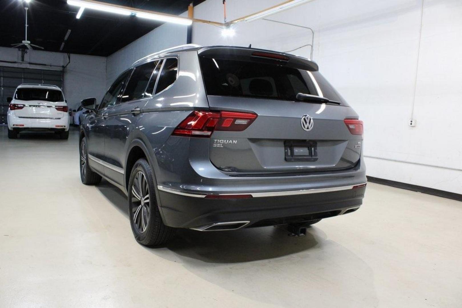 2018 Platinum Gray Metallic /Titan Black Volkswagen Tiguan 2.0T SEL (3VV2B7AX3JM) with an 2.0L TSI DOHC engine, Automatic transmission, located at 15300 Midway Rd., Addison, TX, 75001, (972) 702-0011, 32.958321, -96.838074 - 2018 Volkswagen Tiguan SEL 4MOTION<br><br>Now Available at Midway Auto Group Addison, Texas<br><br>Spacious, capable, and engineered for everyday versatilitythe 2018 Volkswagen Tiguan S 4MOTION offers three-row flexibility, a smooth turbocharged drive, and the confidence of VWs advanced all-wheel-d - Photo#3