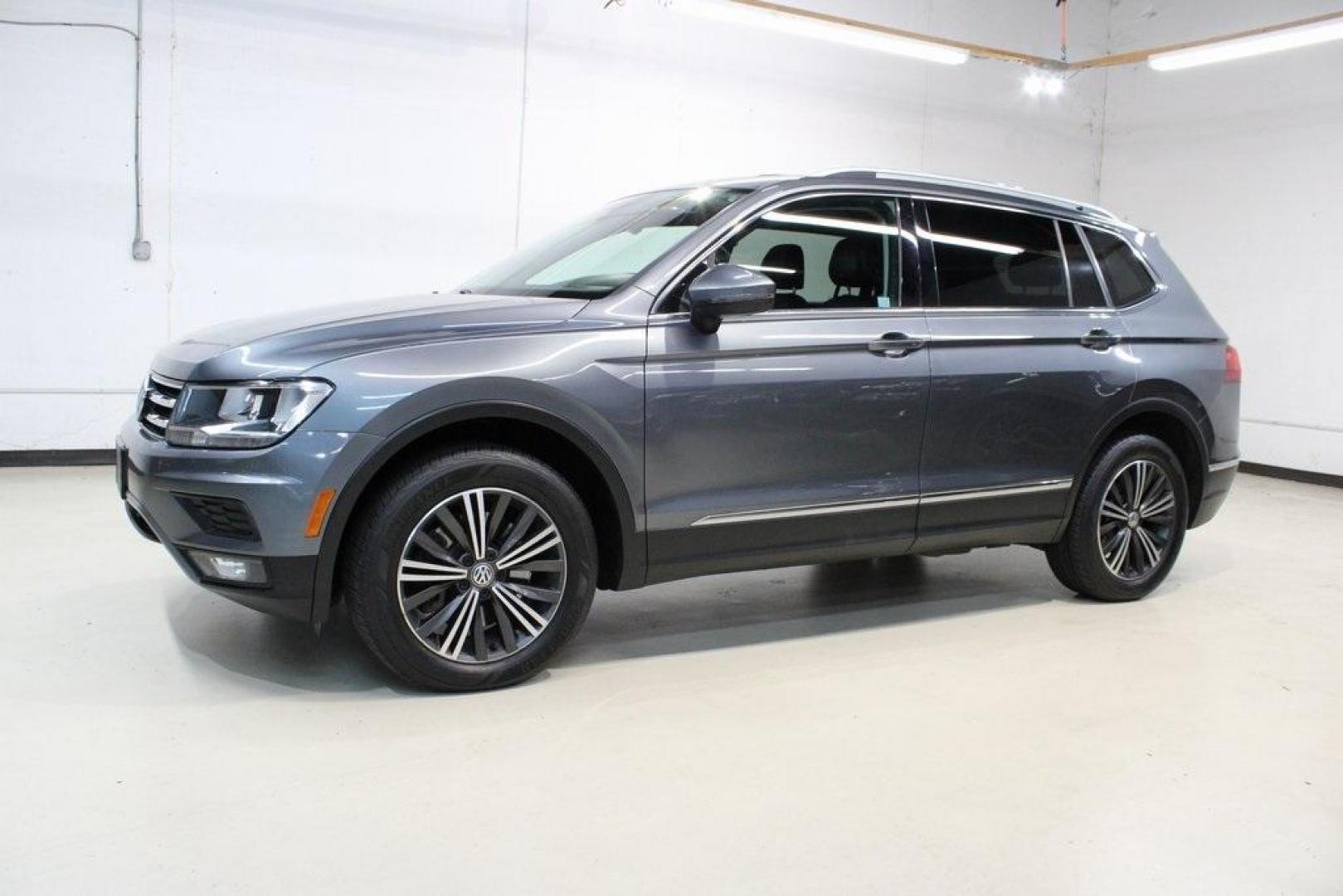 2018 Platinum Gray Metallic /Titan Black Volkswagen Tiguan 2.0T SEL (3VV2B7AX3JM) with an 2.0L TSI DOHC engine, Automatic transmission, located at 15300 Midway Rd., Addison, TX, 75001, (972) 702-0011, 32.958321, -96.838074 - 2018 Volkswagen Tiguan SEL 4MOTION<br><br>Now Available at Midway Auto Group Addison, Texas<br><br>Spacious, capable, and engineered for everyday versatilitythe 2018 Volkswagen Tiguan S 4MOTION offers three-row flexibility, a smooth turbocharged drive, and the confidence of VWs advanced all-wheel-d - Photo#4