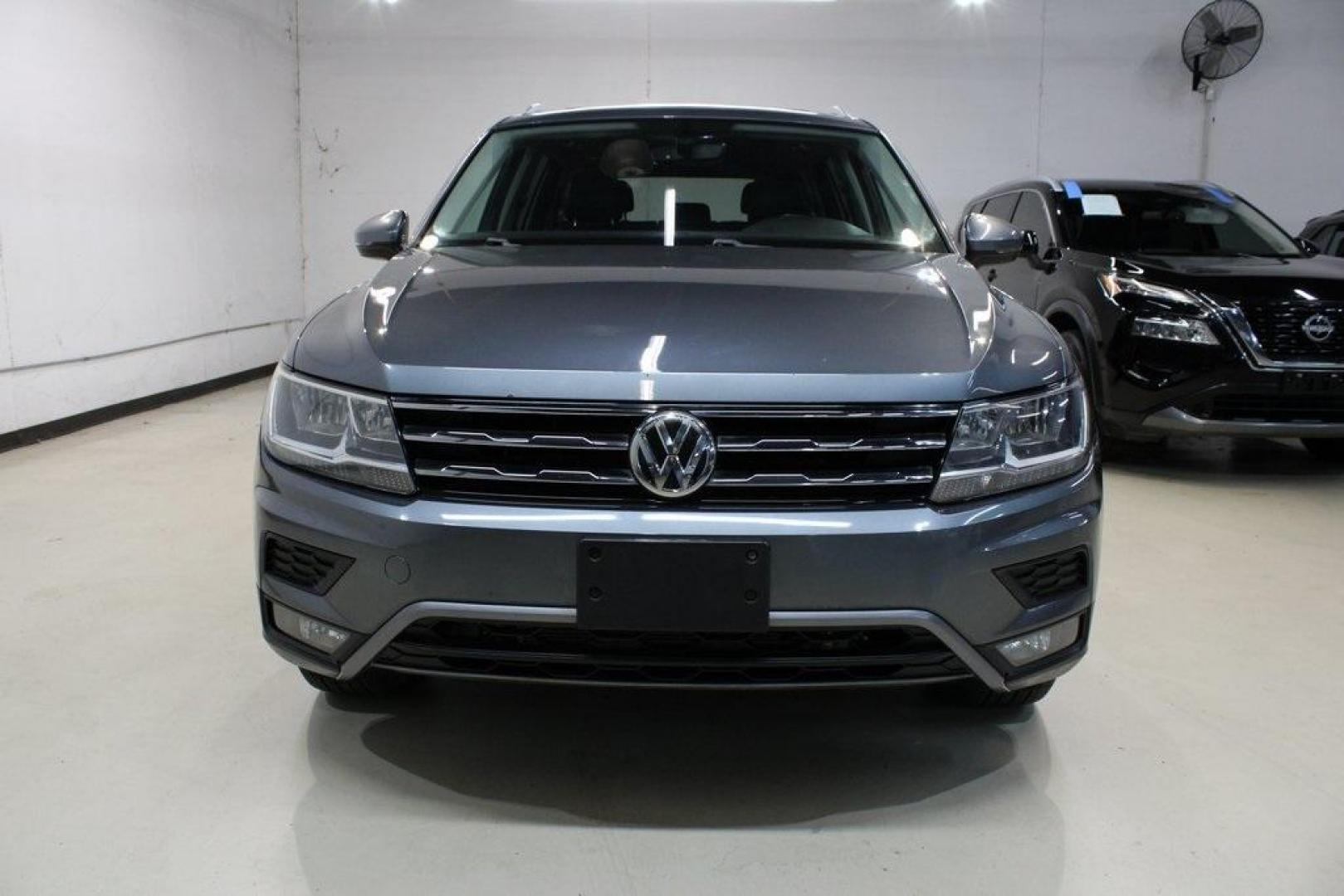 2018 Platinum Gray Metallic /Titan Black Volkswagen Tiguan 2.0T SEL (3VV2B7AX3JM) with an 2.0L TSI DOHC engine, Automatic transmission, located at 15300 Midway Rd., Addison, TX, 75001, (972) 702-0011, 32.958321, -96.838074 - 2018 Volkswagen Tiguan SEL 4MOTION<br><br>Now Available at Midway Auto Group Addison, Texas<br><br>Spacious, capable, and engineered for everyday versatilitythe 2018 Volkswagen Tiguan S 4MOTION offers three-row flexibility, a smooth turbocharged drive, and the confidence of VWs advanced all-wheel-d - Photo#5