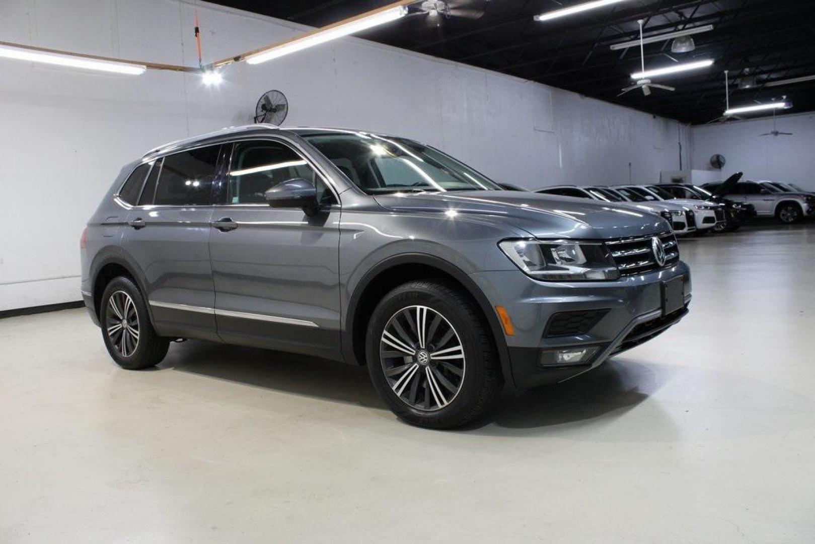 2018 Platinum Gray Metallic /Titan Black Volkswagen Tiguan 2.0T SEL (3VV2B7AX3JM) with an 2.0L TSI DOHC engine, Automatic transmission, located at 15300 Midway Rd., Addison, TX, 75001, (972) 702-0011, 32.958321, -96.838074 - 2018 Volkswagen Tiguan SEL 4MOTION<br><br>Now Available at Midway Auto Group Addison, Texas<br><br>Spacious, capable, and engineered for everyday versatilitythe 2018 Volkswagen Tiguan S 4MOTION offers three-row flexibility, a smooth turbocharged drive, and the confidence of VWs advanced all-wheel-d - Photo#6