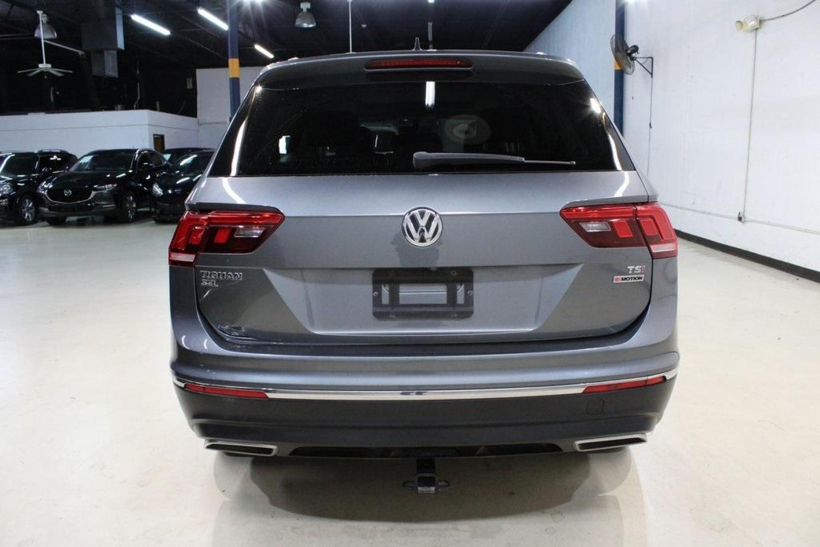 2018 Platinum Gray Metallic /Titan Black Volkswagen Tiguan 2.0T SEL (3VV2B7AX3JM) with an 2.0L TSI DOHC engine, Automatic transmission, located at 15300 Midway Rd., Addison, TX, 75001, (972) 702-0011, 32.958321, -96.838074 - 2018 Volkswagen Tiguan SEL 4MOTION<br><br>Now Available at Midway Auto Group Addison, Texas<br><br>Spacious, capable, and engineered for everyday versatilitythe 2018 Volkswagen Tiguan S 4MOTION offers three-row flexibility, a smooth turbocharged drive, and the confidence of VWs advanced all-wheel-d - Photo#7