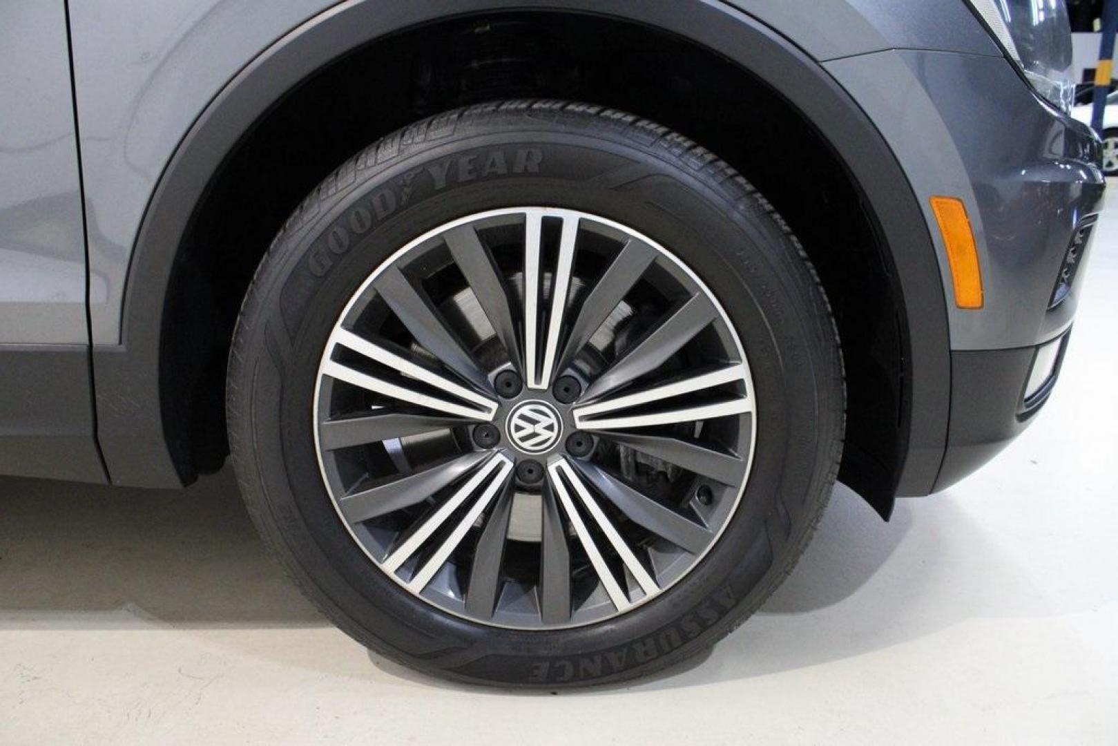 2018 Platinum Gray Metallic /Titan Black Volkswagen Tiguan 2.0T SEL (3VV2B7AX3JM) with an 2.0L TSI DOHC engine, Automatic transmission, located at 15300 Midway Rd., Addison, TX, 75001, (972) 702-0011, 32.958321, -96.838074 - 2018 Volkswagen Tiguan SEL 4MOTION<br><br>Now Available at Midway Auto Group Addison, Texas<br><br>Spacious, capable, and engineered for everyday versatilitythe 2018 Volkswagen Tiguan S 4MOTION offers three-row flexibility, a smooth turbocharged drive, and the confidence of VWs advanced all-wheel-d - Photo#11