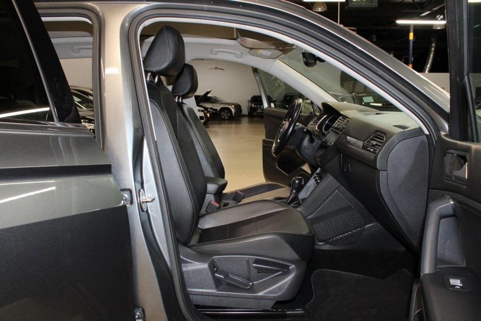 2018 Platinum Gray Metallic /Titan Black Volkswagen Tiguan 2.0T SEL (3VV2B7AX3JM) with an 2.0L TSI DOHC engine, Automatic transmission, located at 15300 Midway Rd., Addison, TX, 75001, (972) 702-0011, 32.958321, -96.838074 - 2018 Volkswagen Tiguan SEL 4MOTION<br><br>Now Available at Midway Auto Group Addison, Texas<br><br>Spacious, capable, and engineered for everyday versatilitythe 2018 Volkswagen Tiguan S 4MOTION offers three-row flexibility, a smooth turbocharged drive, and the confidence of VWs advanced all-wheel-d - Photo#14