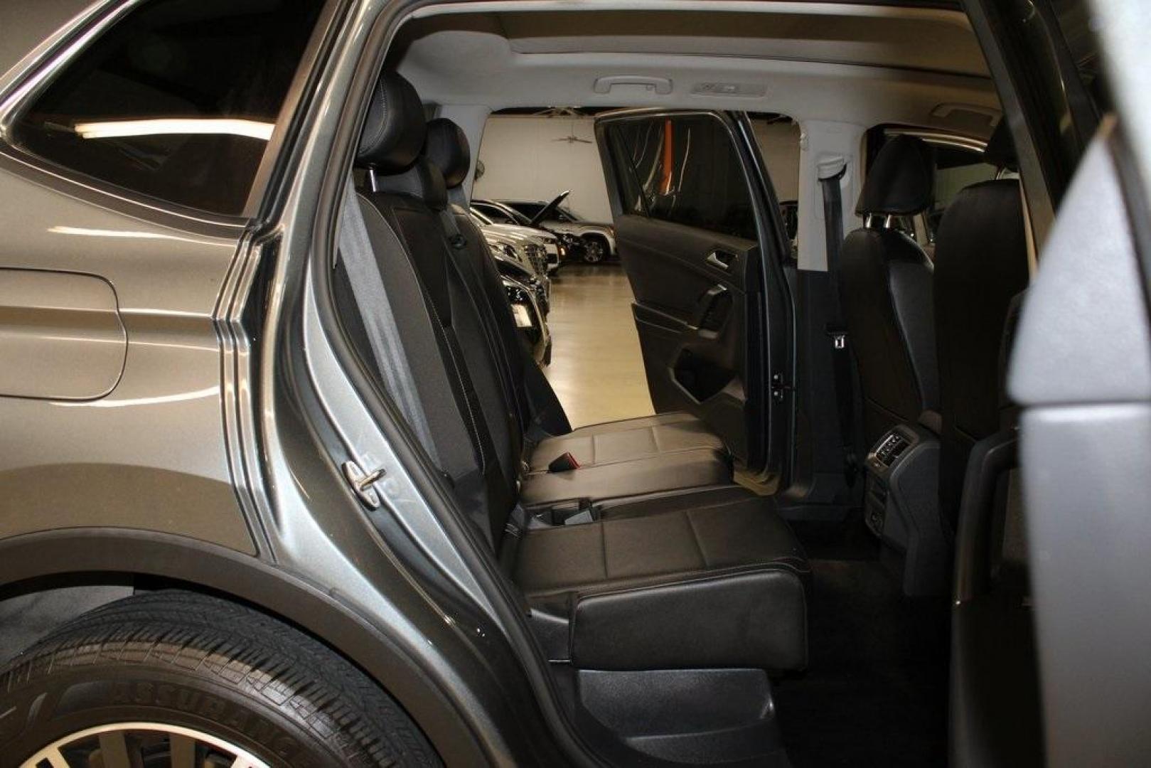 2018 Platinum Gray Metallic /Titan Black Volkswagen Tiguan 2.0T SEL (3VV2B7AX3JM) with an 2.0L TSI DOHC engine, Automatic transmission, located at 15300 Midway Rd., Addison, TX, 75001, (972) 702-0011, 32.958321, -96.838074 - 2018 Volkswagen Tiguan SEL 4MOTION<br><br>Now Available at Midway Auto Group Addison, Texas<br><br>Spacious, capable, and engineered for everyday versatilitythe 2018 Volkswagen Tiguan S 4MOTION offers three-row flexibility, a smooth turbocharged drive, and the confidence of VWs advanced all-wheel-d - Photo#15