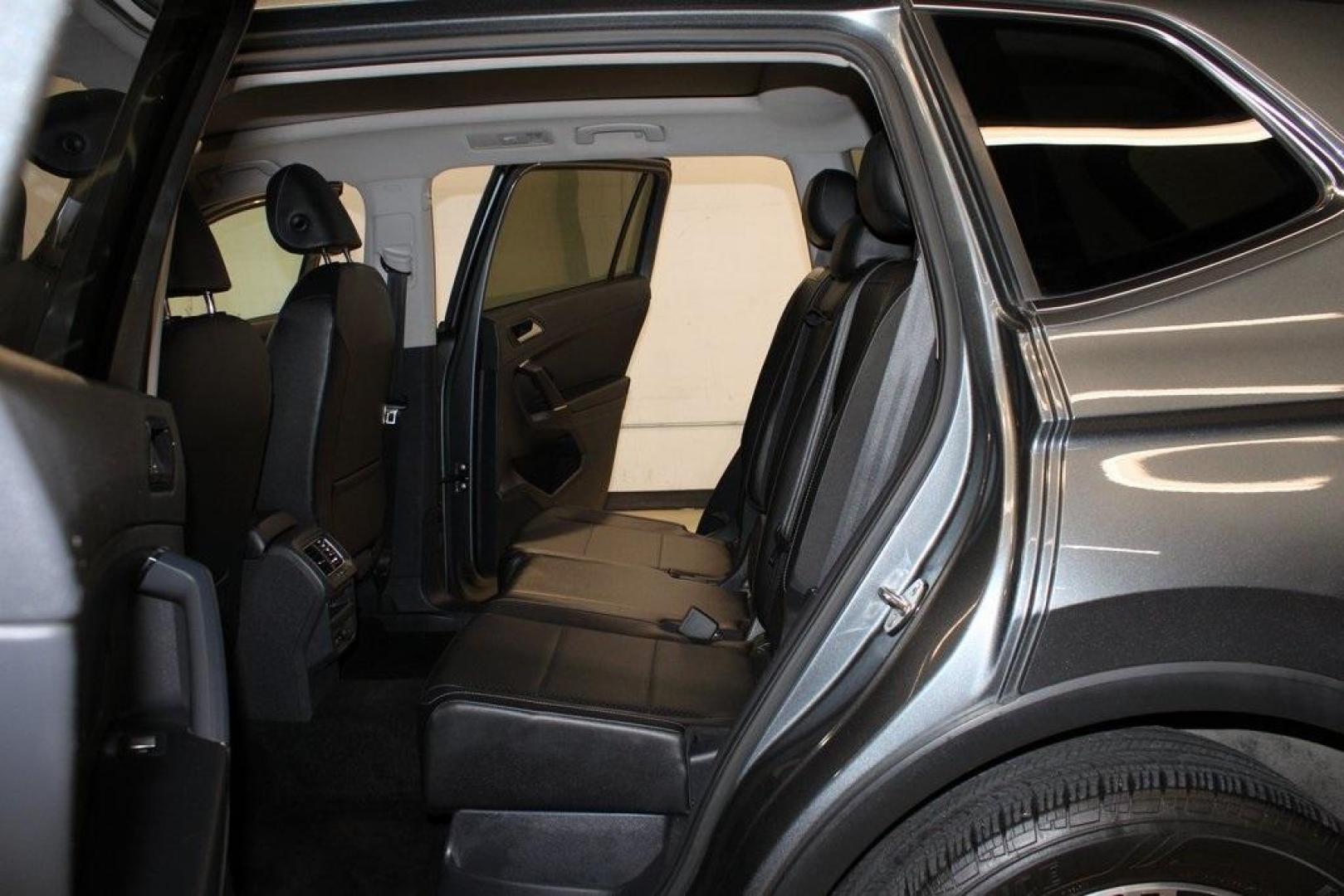 2018 Platinum Gray Metallic /Titan Black Volkswagen Tiguan 2.0T SEL (3VV2B7AX3JM) with an 2.0L TSI DOHC engine, Automatic transmission, located at 15300 Midway Rd., Addison, TX, 75001, (972) 702-0011, 32.958321, -96.838074 - 2018 Volkswagen Tiguan SEL 4MOTION<br><br>Now Available at Midway Auto Group Addison, Texas<br><br>Spacious, capable, and engineered for everyday versatilitythe 2018 Volkswagen Tiguan S 4MOTION offers three-row flexibility, a smooth turbocharged drive, and the confidence of VWs advanced all-wheel-d - Photo#16