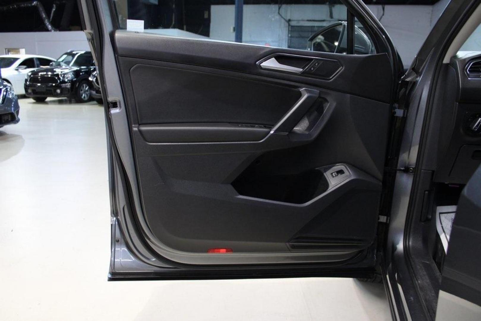 2018 Platinum Gray Metallic /Titan Black Volkswagen Tiguan 2.0T SEL (3VV2B7AX3JM) with an 2.0L TSI DOHC engine, Automatic transmission, located at 15300 Midway Rd., Addison, TX, 75001, (972) 702-0011, 32.958321, -96.838074 - 2018 Volkswagen Tiguan SEL 4MOTION<br><br>Now Available at Midway Auto Group Addison, Texas<br><br>Spacious, capable, and engineered for everyday versatilitythe 2018 Volkswagen Tiguan S 4MOTION offers three-row flexibility, a smooth turbocharged drive, and the confidence of VWs advanced all-wheel-d - Photo#26