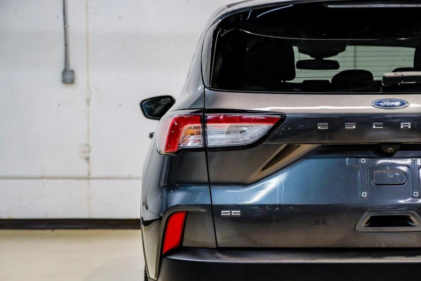 2020 Magnetic /Ebony Ford Escape SE (1FMCU0G64LU) with an 1.5L EcoBoost engine, Automatic transmission, located at 15300 Midway Rd., Addison, TX, 75001, (972) 702-0011, 32.958321, -96.838074 - Photo#54