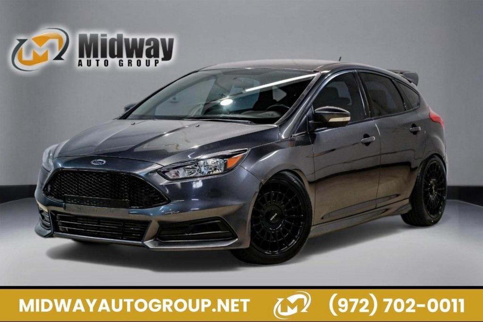 2015 Magnetic /Black Ford Focus ST (1FADP3L93FL) with an EcoBoost 2.0L I4 GTDi DOHC Turbocharged VCT engine, Manual transmission, located at 15300 Midway Rd., Addison, TX, 75001, (972) 702-0011, 32.958321, -96.838074 - 2015 Ford Focus ST<br><br>Now Available at Midway Auto Group, Addison, Texas<br><br>Sporty, aggressive, and built for enthusiasts the 2015 Ford Focus ST delivers turbocharged performance, sharp handling, and a driver-focused interior that sets it apart from traditional compact cars. With its signatu - Photo#0