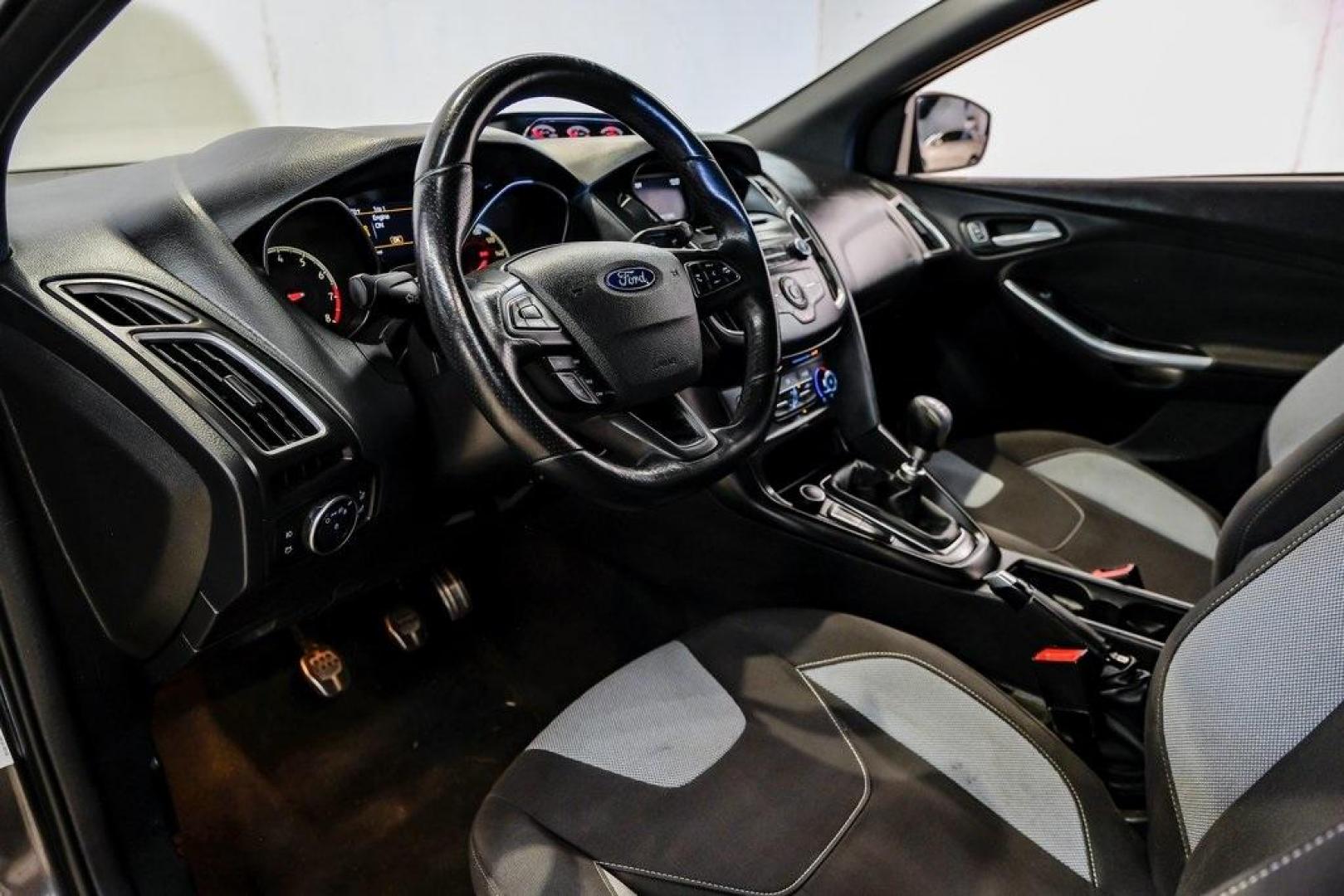 2015 Magnetic /Black Ford Focus ST (1FADP3L93FL) with an EcoBoost 2.0L I4 GTDi DOHC Turbocharged VCT engine, Manual transmission, located at 15300 Midway Rd., Addison, TX, 75001, (972) 702-0011, 32.958321, -96.838074 - 2015 Ford Focus ST<br><br>Now Available at Midway Auto Group, Addison, Texas<br><br>Sporty, aggressive, and built for enthusiasts the 2015 Ford Focus ST delivers turbocharged performance, sharp handling, and a driver-focused interior that sets it apart from traditional compact cars. With its signatu - Photo#2