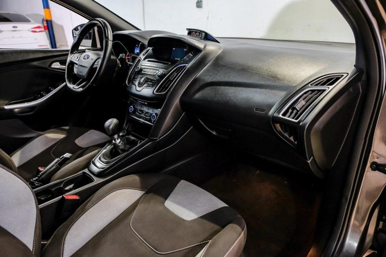 2015 Magnetic /Black Ford Focus ST (1FADP3L93FL) with an EcoBoost 2.0L I4 GTDi DOHC Turbocharged VCT engine, Manual transmission, located at 15300 Midway Rd., Addison, TX, 75001, (972) 702-0011, 32.958321, -96.838074 - 2015 Ford Focus ST<br><br>Now Available at Midway Auto Group, Addison, Texas<br><br>Sporty, aggressive, and built for enthusiasts the 2015 Ford Focus ST delivers turbocharged performance, sharp handling, and a driver-focused interior that sets it apart from traditional compact cars. With its signatu - Photo#17