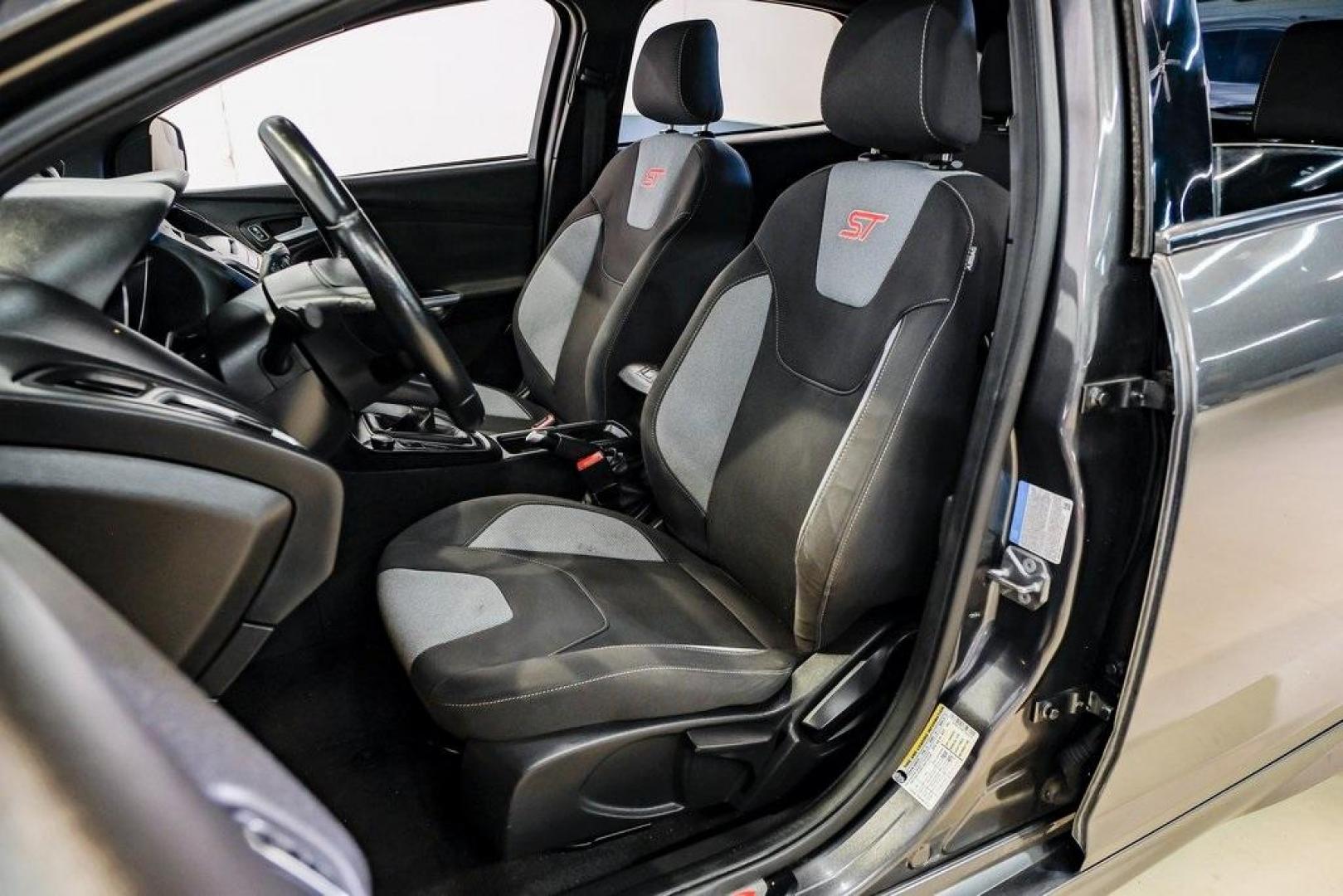 2015 Magnetic /Black Ford Focus ST (1FADP3L93FL) with an EcoBoost 2.0L I4 GTDi DOHC Turbocharged VCT engine, Manual transmission, located at 15300 Midway Rd., Addison, TX, 75001, (972) 702-0011, 32.958321, -96.838074 - 2015 Ford Focus ST<br><br>Now Available at Midway Auto Group, Addison, Texas<br><br>Sporty, aggressive, and built for enthusiasts the 2015 Ford Focus ST delivers turbocharged performance, sharp handling, and a driver-focused interior that sets it apart from traditional compact cars. With its signatu - Photo#37