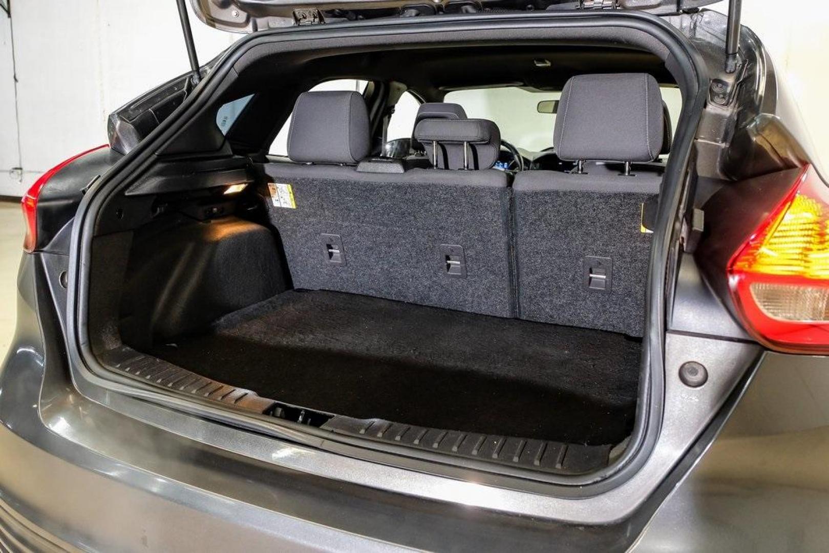 2015 Magnetic /Black Ford Focus ST (1FADP3L93FL) with an EcoBoost 2.0L I4 GTDi DOHC Turbocharged VCT engine, Manual transmission, located at 15300 Midway Rd., Addison, TX, 75001, (972) 702-0011, 32.958321, -96.838074 - 2015 Ford Focus ST<br><br>Now Available at Midway Auto Group, Addison, Texas<br><br>Sporty, aggressive, and built for enthusiasts the 2015 Ford Focus ST delivers turbocharged performance, sharp handling, and a driver-focused interior that sets it apart from traditional compact cars. With its signatu - Photo#56