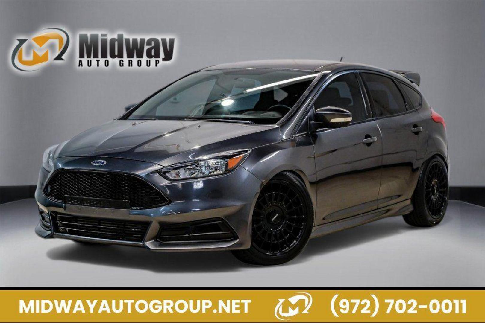 2015 Magnetic /Black Ford Focus ST (1FADP3L93FL) with an EcoBoost 2.0L I4 GTDi DOHC Turbocharged VCT engine, Manual transmission, located at 15300 Midway Rd., Addison, TX, 75001, (972) 702-0011, 32.958321, -96.838074 - 2015 Ford Focus ST<br><br>Now Available at Midway Auto Group, Addison, Texas<br><br>Sporty, aggressive, and built for enthusiasts the 2015 Ford Focus ST delivers turbocharged performance, sharp handling, and a driver-focused interior that sets it apart from traditional compact cars. With its signatu - Photo#0