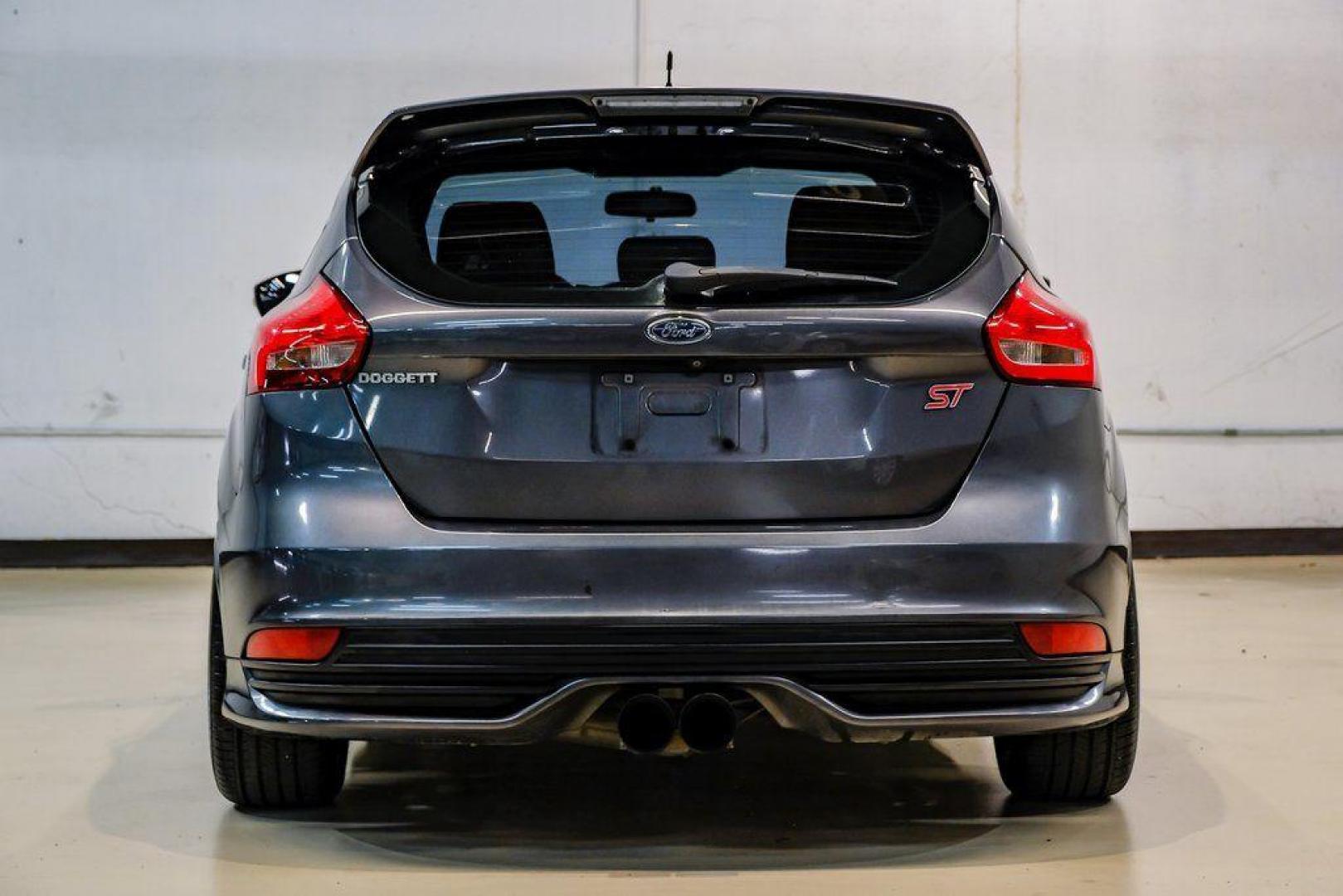2015 Magnetic /Black Ford Focus ST (1FADP3L93FL) with an EcoBoost 2.0L I4 GTDi DOHC Turbocharged VCT engine, Manual transmission, located at 15300 Midway Rd., Addison, TX, 75001, (972) 702-0011, 32.958321, -96.838074 - 2015 Ford Focus ST<br><br>Now Available at Midway Auto Group, Addison, Texas<br><br>Sporty, aggressive, and built for enthusiasts the 2015 Ford Focus ST delivers turbocharged performance, sharp handling, and a driver-focused interior that sets it apart from traditional compact cars. With its signatu - Photo#12