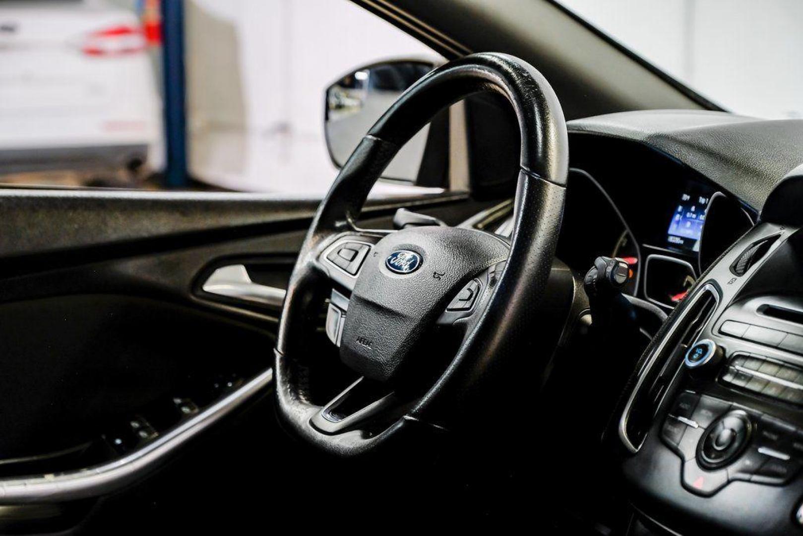 2015 Magnetic /Black Ford Focus ST (1FADP3L93FL) with an EcoBoost 2.0L I4 GTDi DOHC Turbocharged VCT engine, Manual transmission, located at 15300 Midway Rd., Addison, TX, 75001, (972) 702-0011, 32.958321, -96.838074 - 2015 Ford Focus ST<br><br>Now Available at Midway Auto Group, Addison, Texas<br><br>Sporty, aggressive, and built for enthusiasts the 2015 Ford Focus ST delivers turbocharged performance, sharp handling, and a driver-focused interior that sets it apart from traditional compact cars. With its signatu - Photo#18